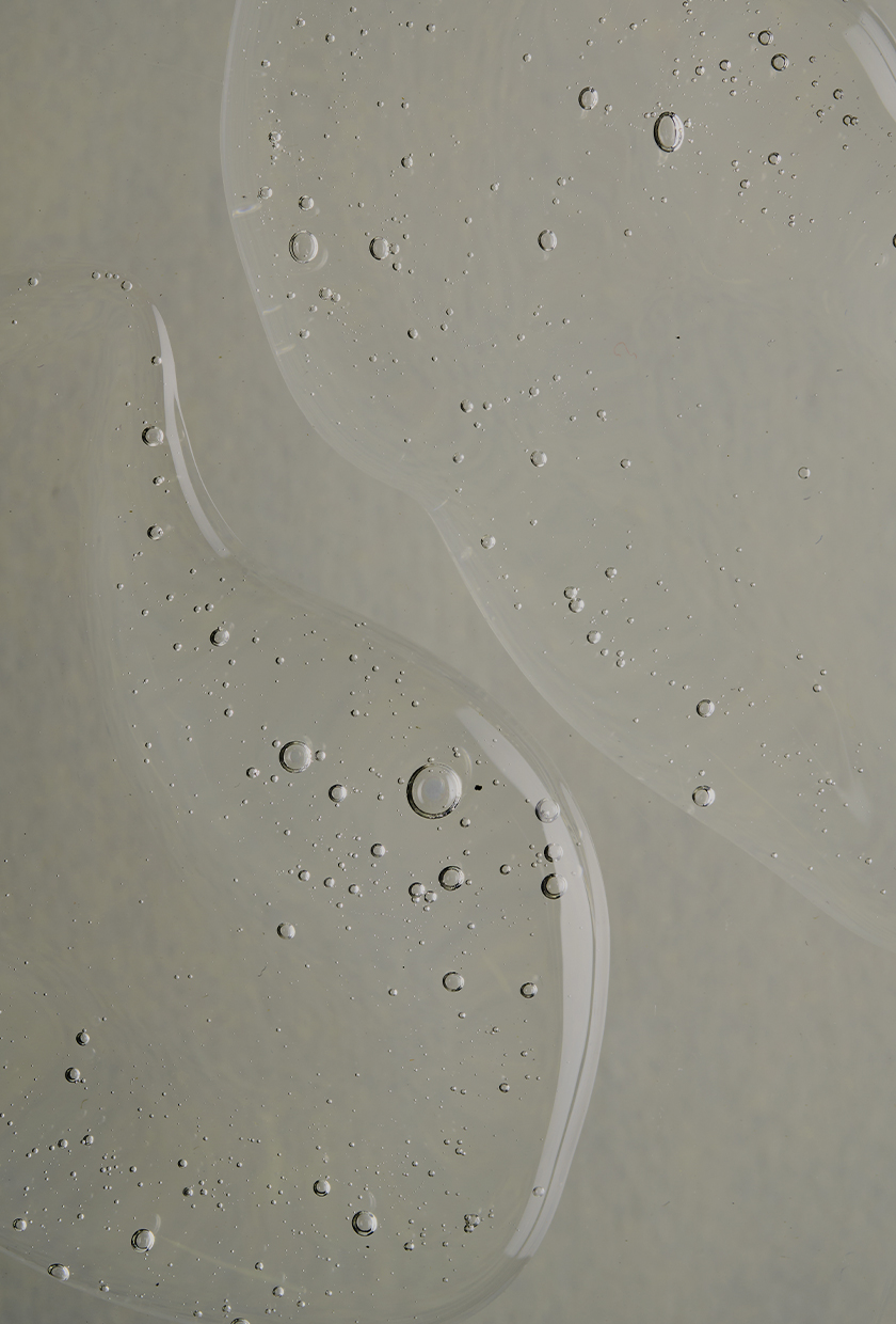 A close-up picture of a skincare serum texture with bubbles