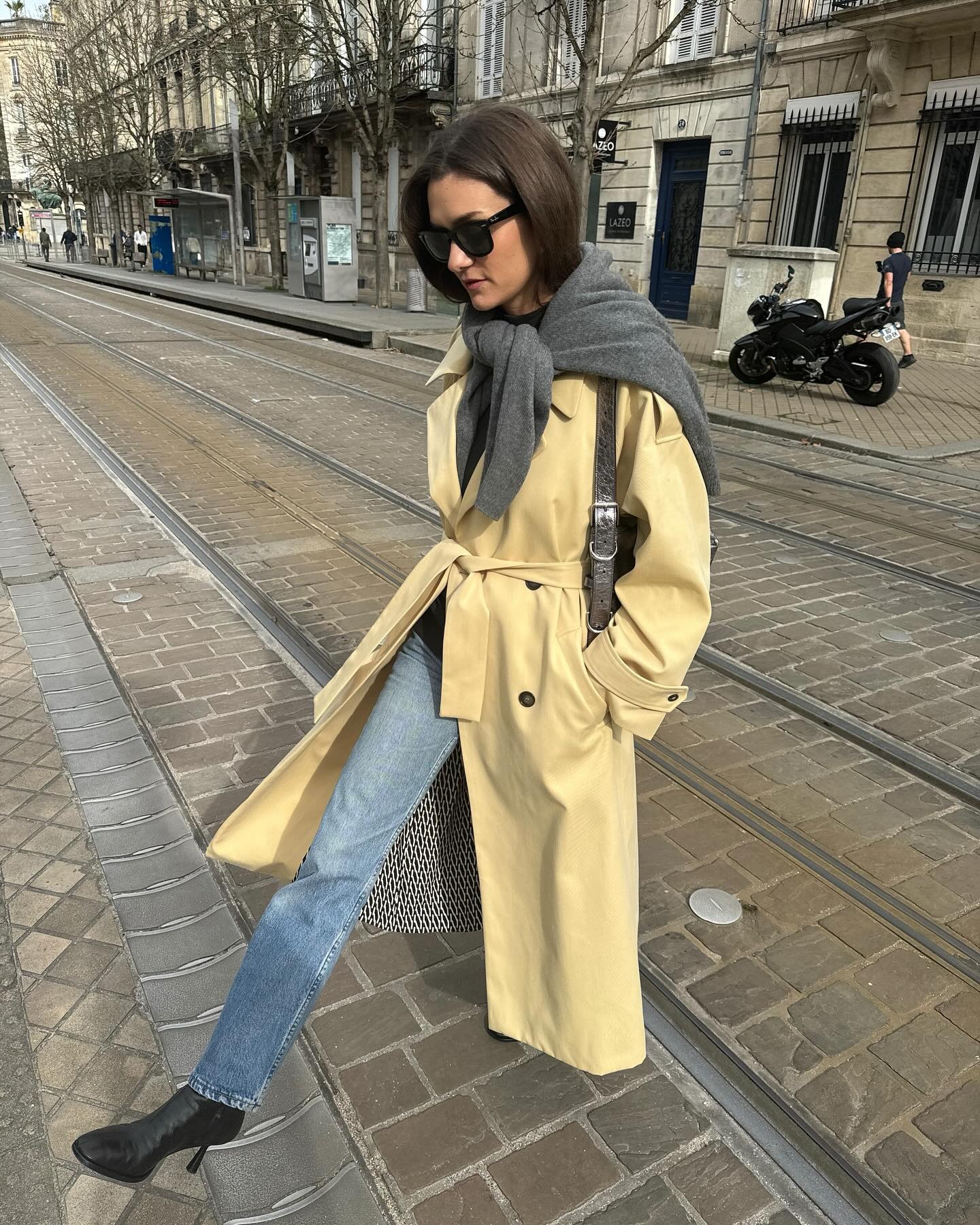 Fashion person Anne Laure-Mais wears a blue skinny jeans outfit