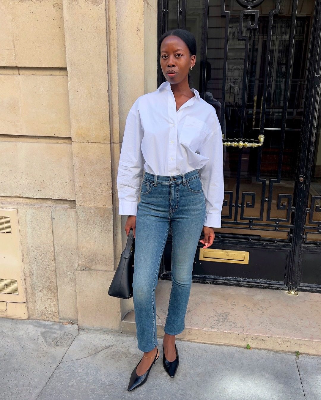Fashion person Sylvie Mus wears a blue skinny jeans outfit
