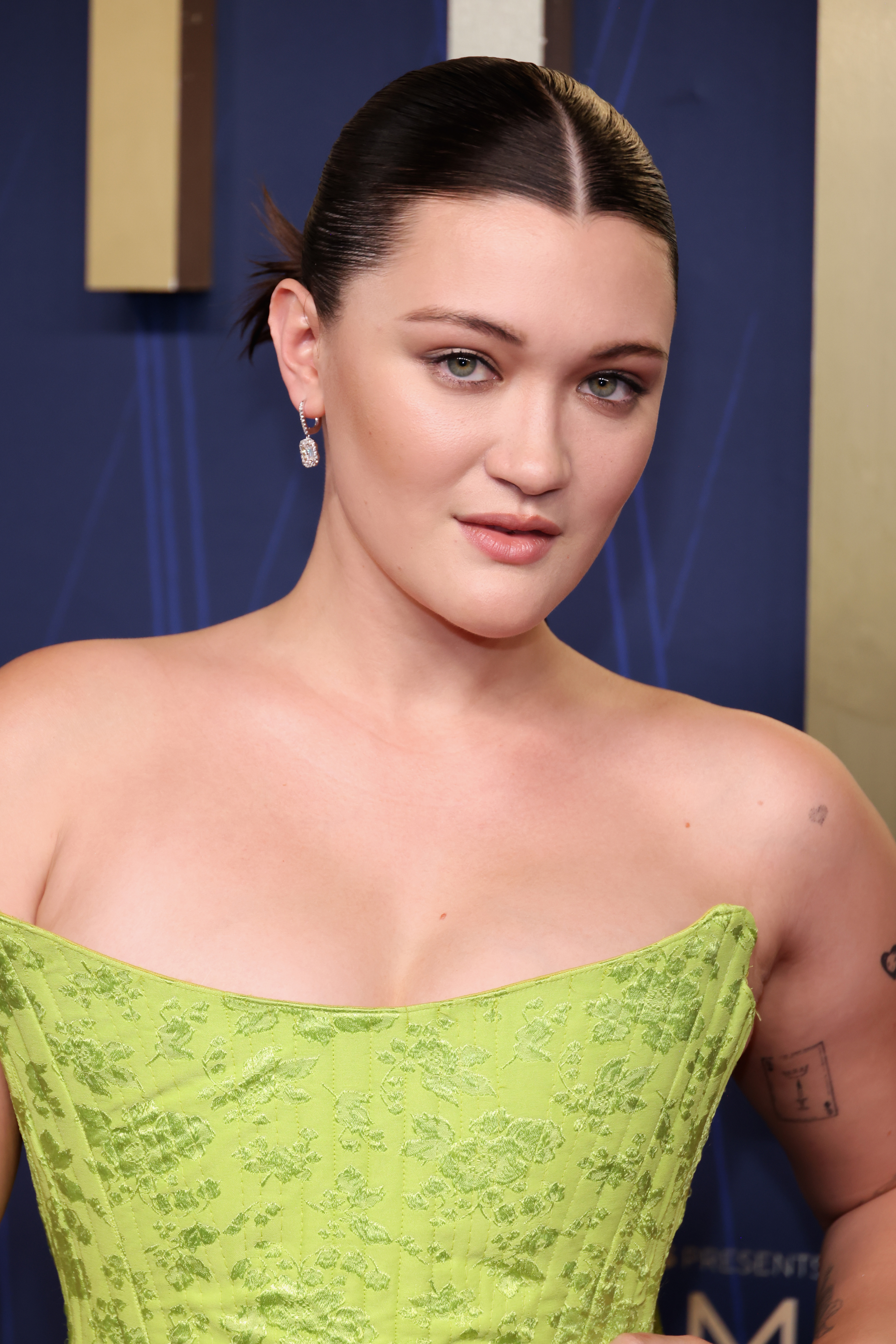 Isa Briones attends the 77th Primetime Emmy Awards red carpet