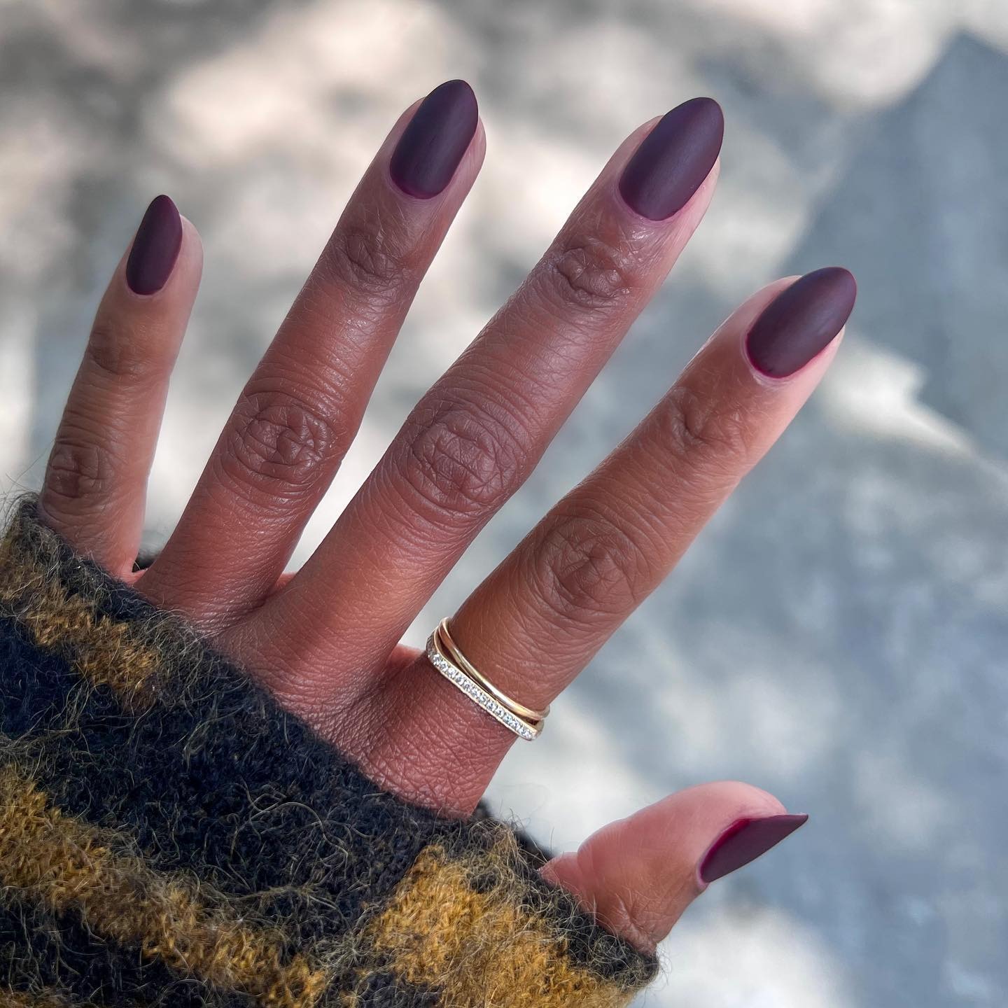 A matte burgundy manicure