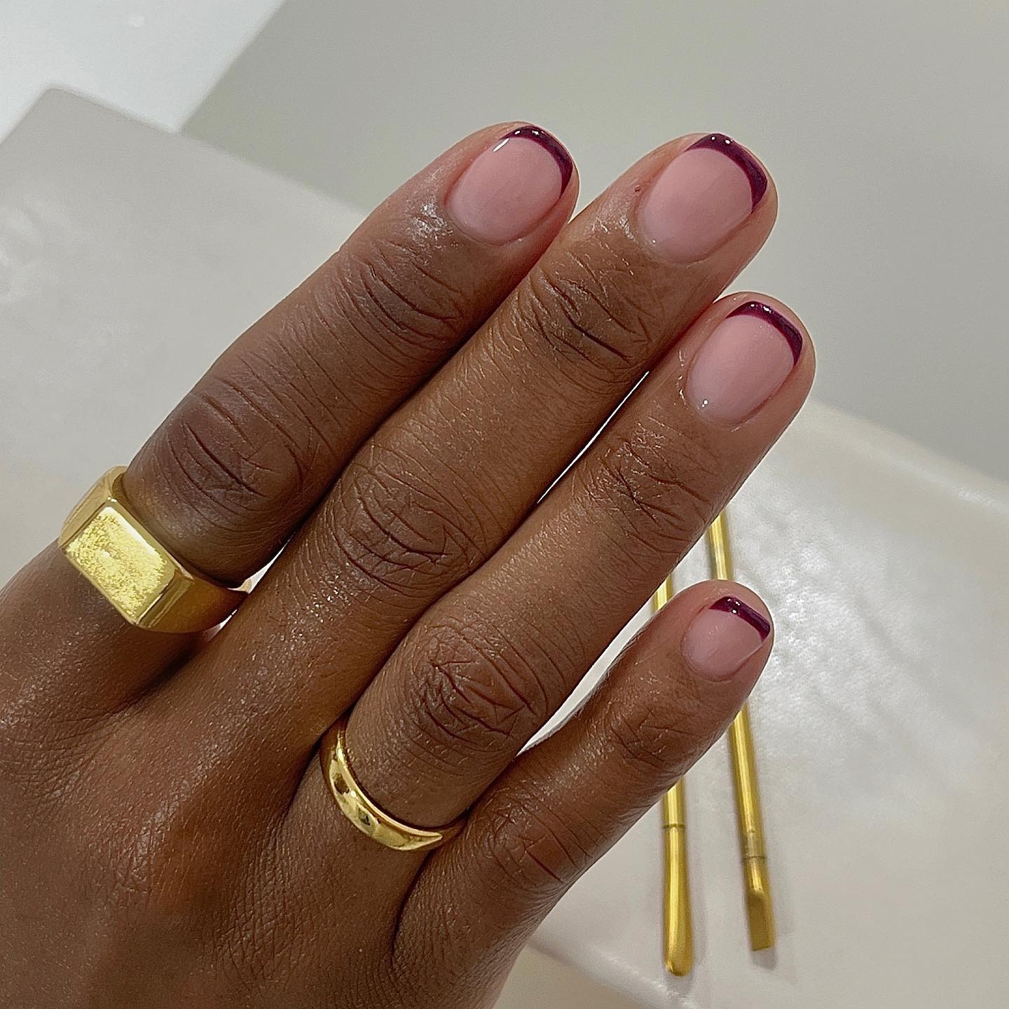 Dark burgundy French tip nails