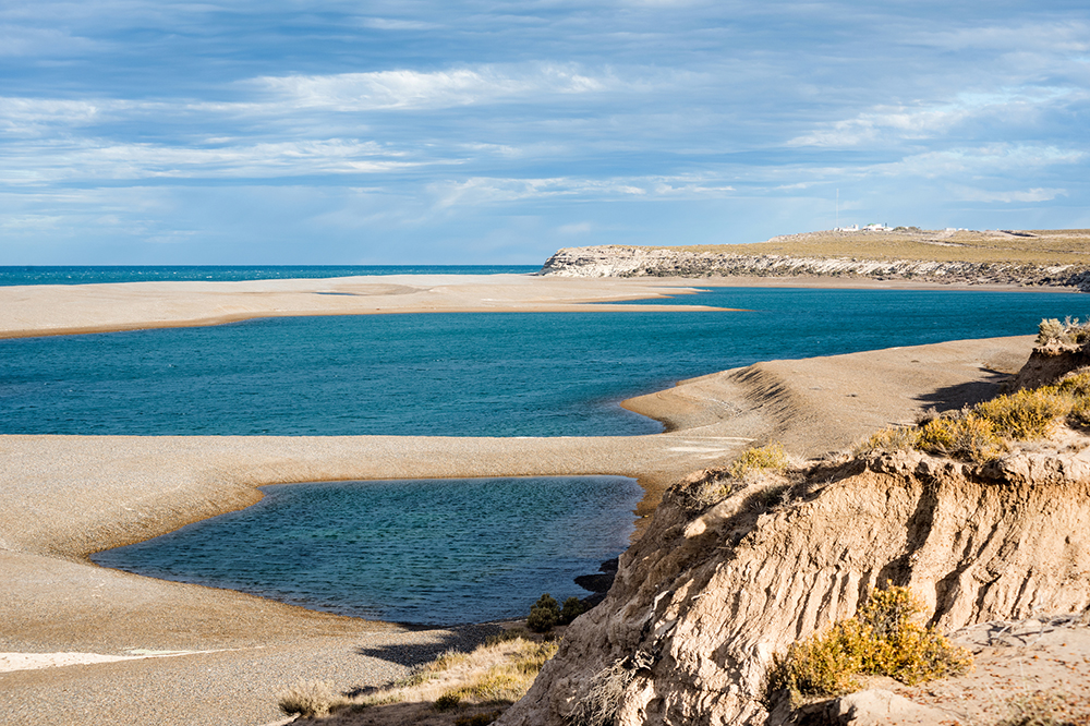 A rugged coast line with sand bars