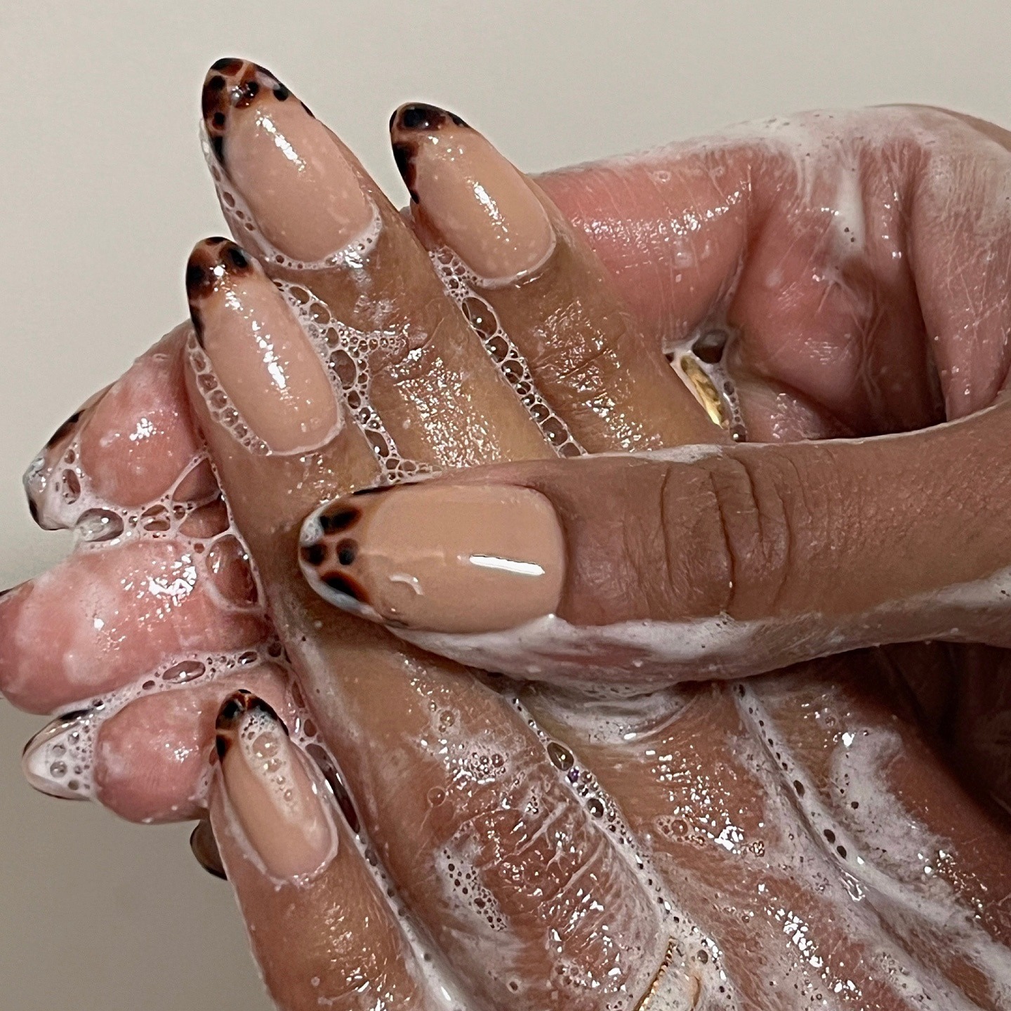 A tortoiseshell print French manicure