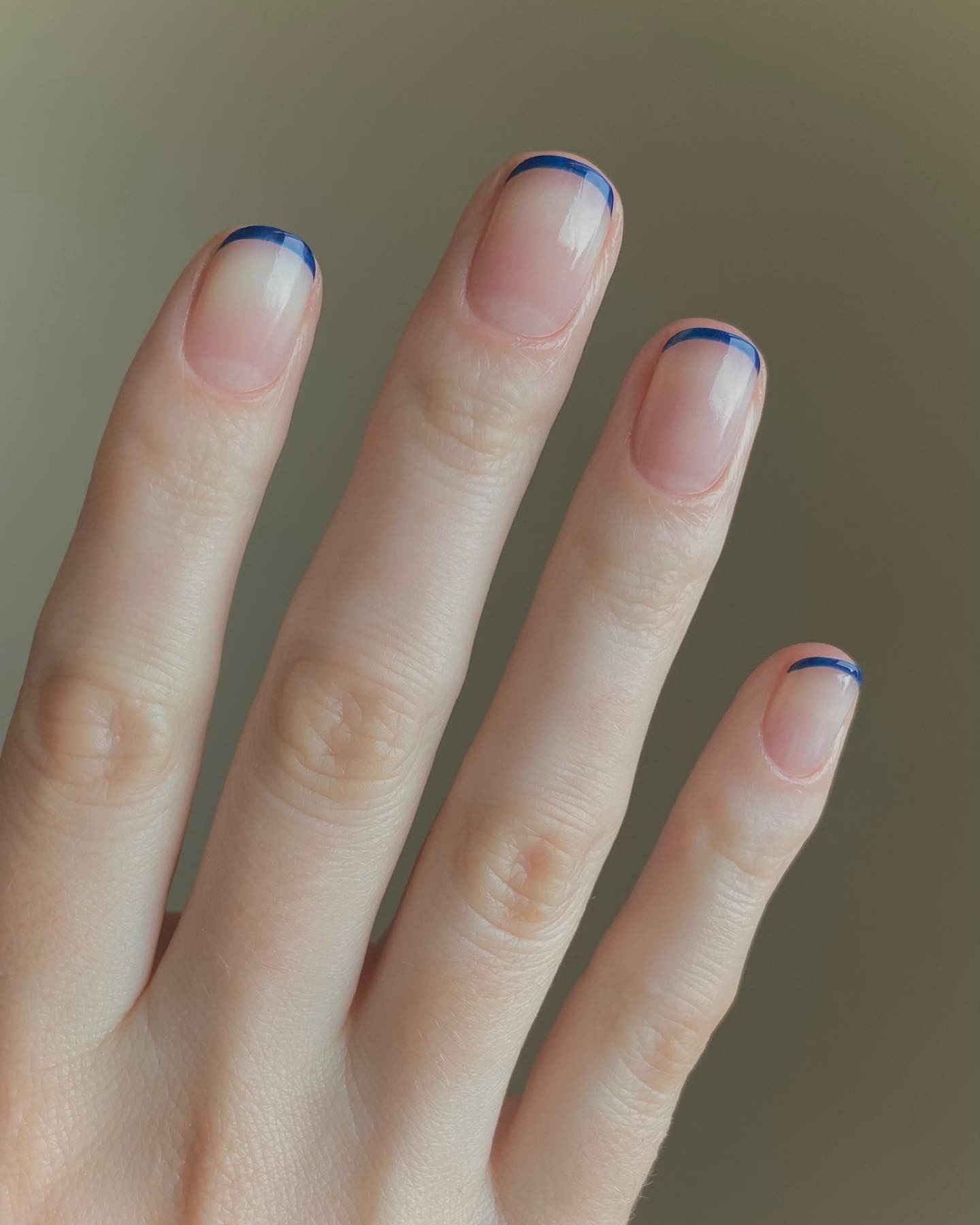 A micro navy French tip manicure