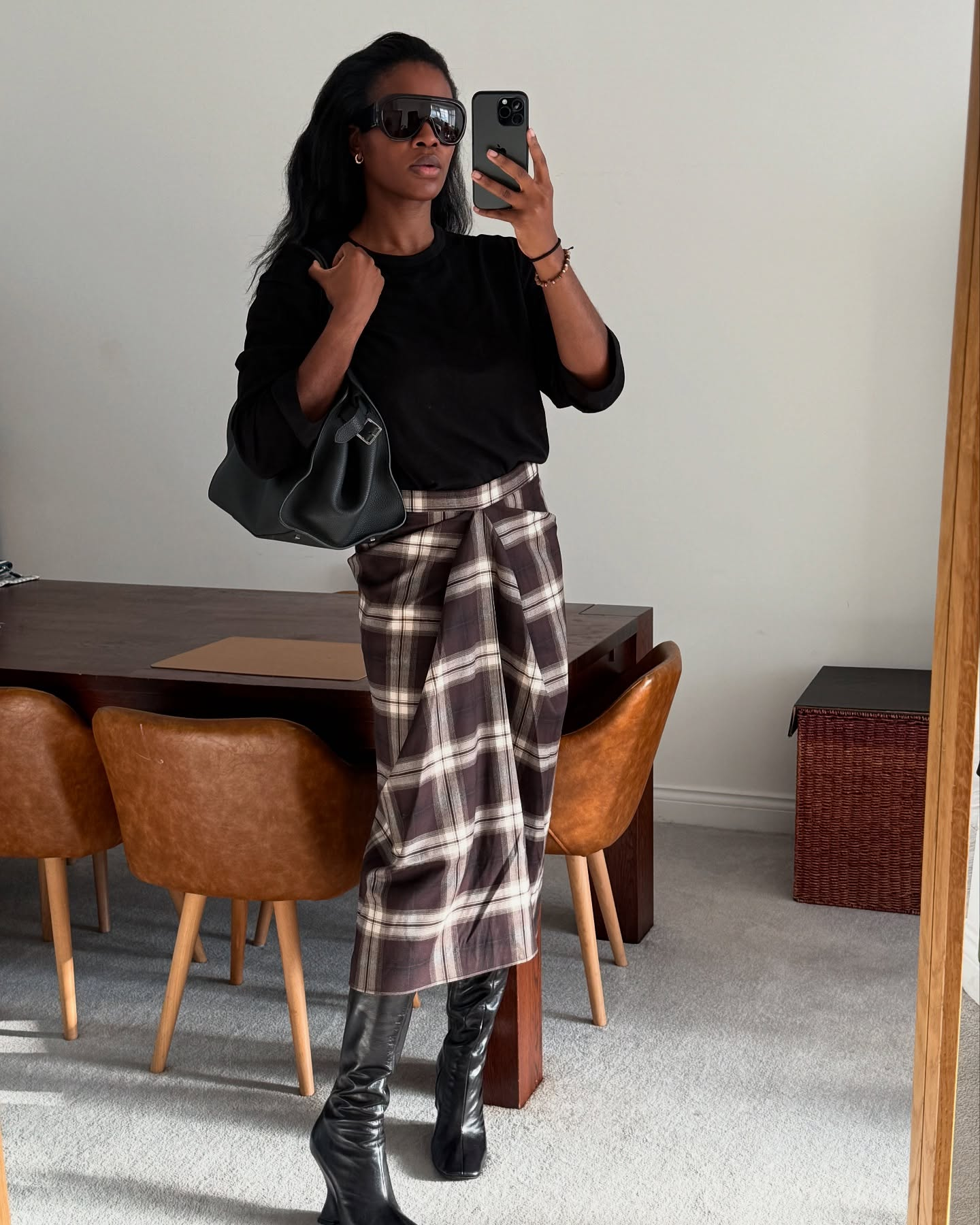 Influencer @nlmarilyn wears COS wrap checked skirt.