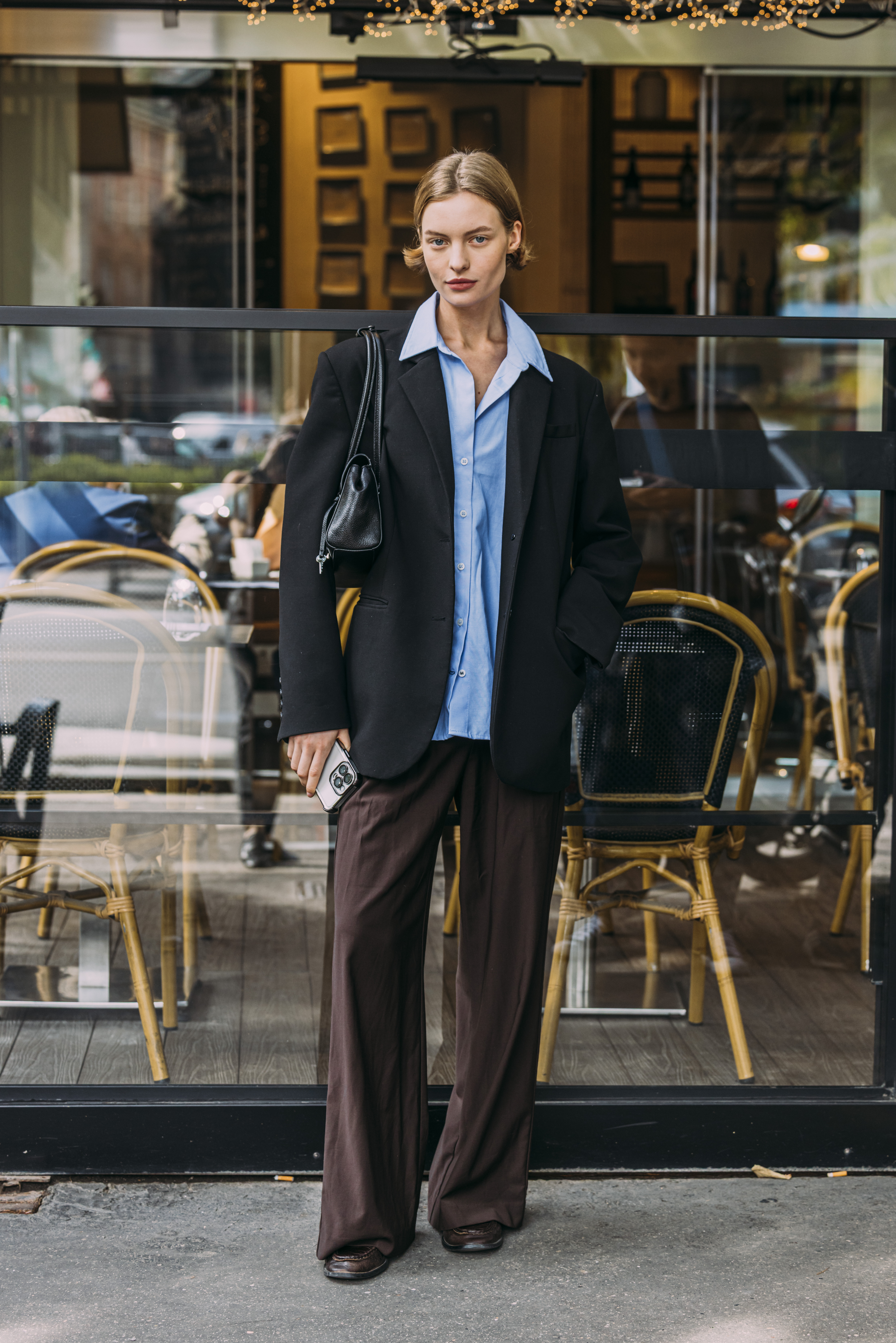 Women in milan wearing black pants outfits.