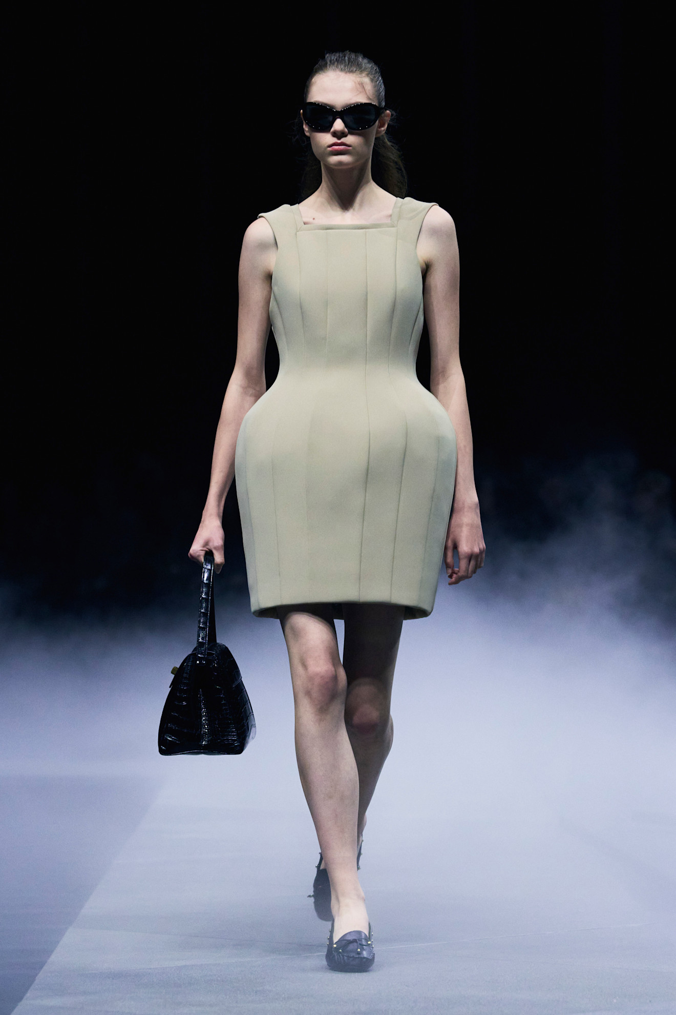 Khaite spring/summer 2026 exaggerated silhouettes on models.