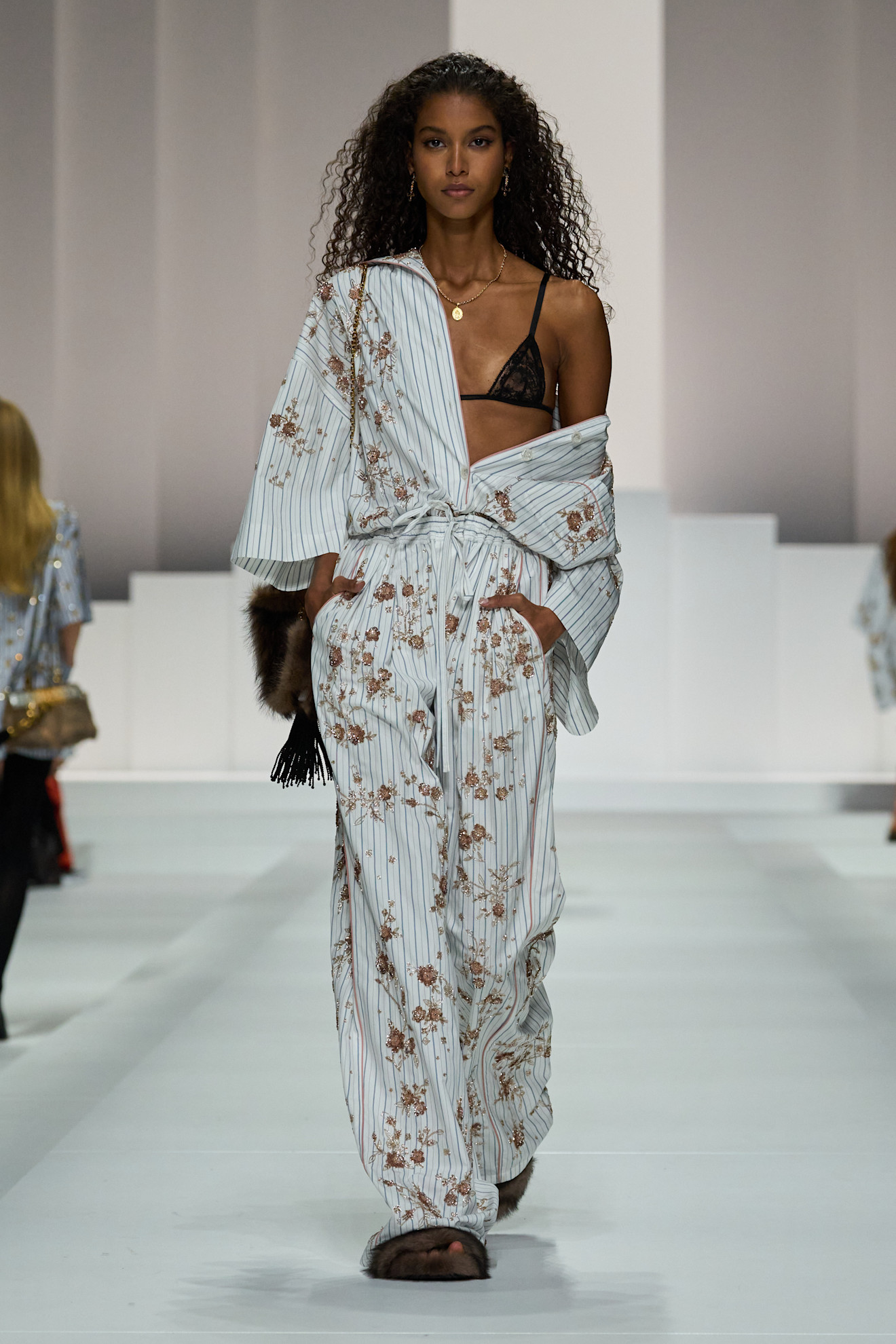 A model on dolce &amp;amp; Gabbana runway wears a pajama-inspired outfit with flroals.