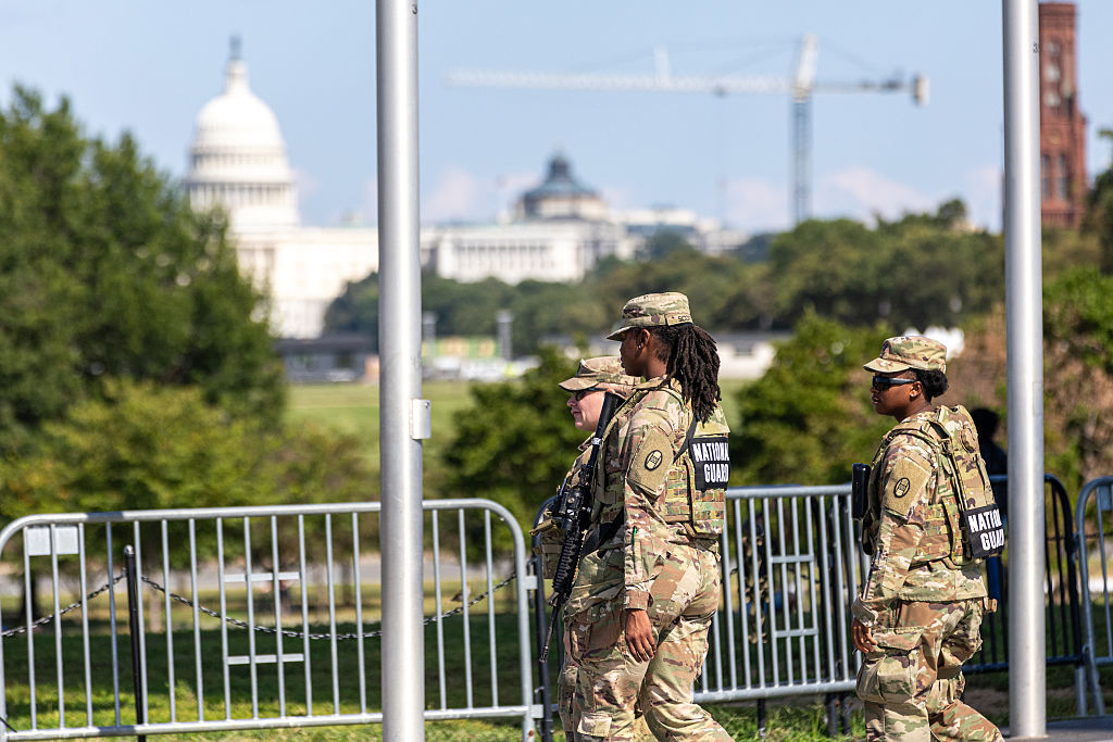 Members Of The National Guard Patrol The National Mall And Seek Shade