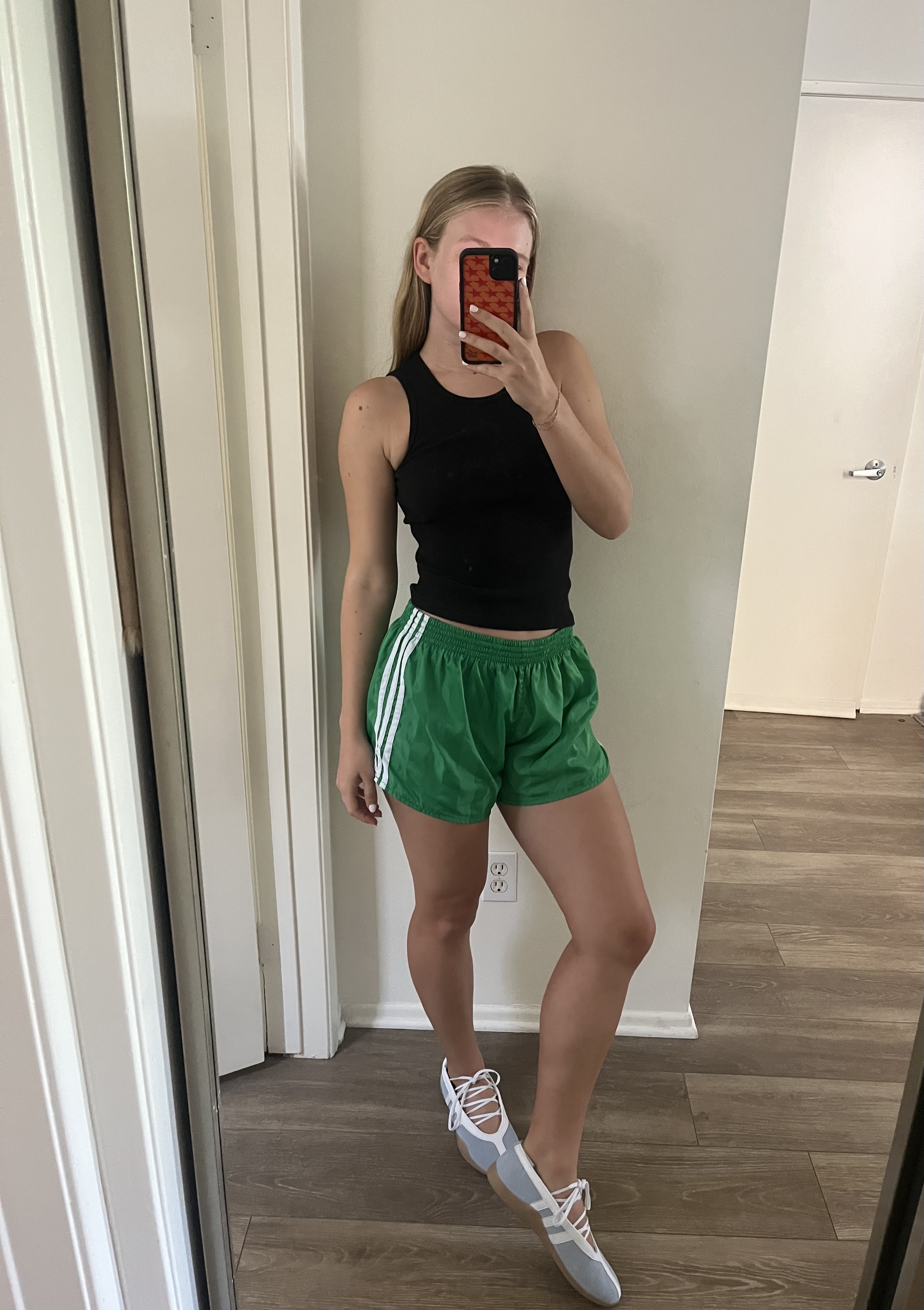 An editor wearing adidas sneakers.