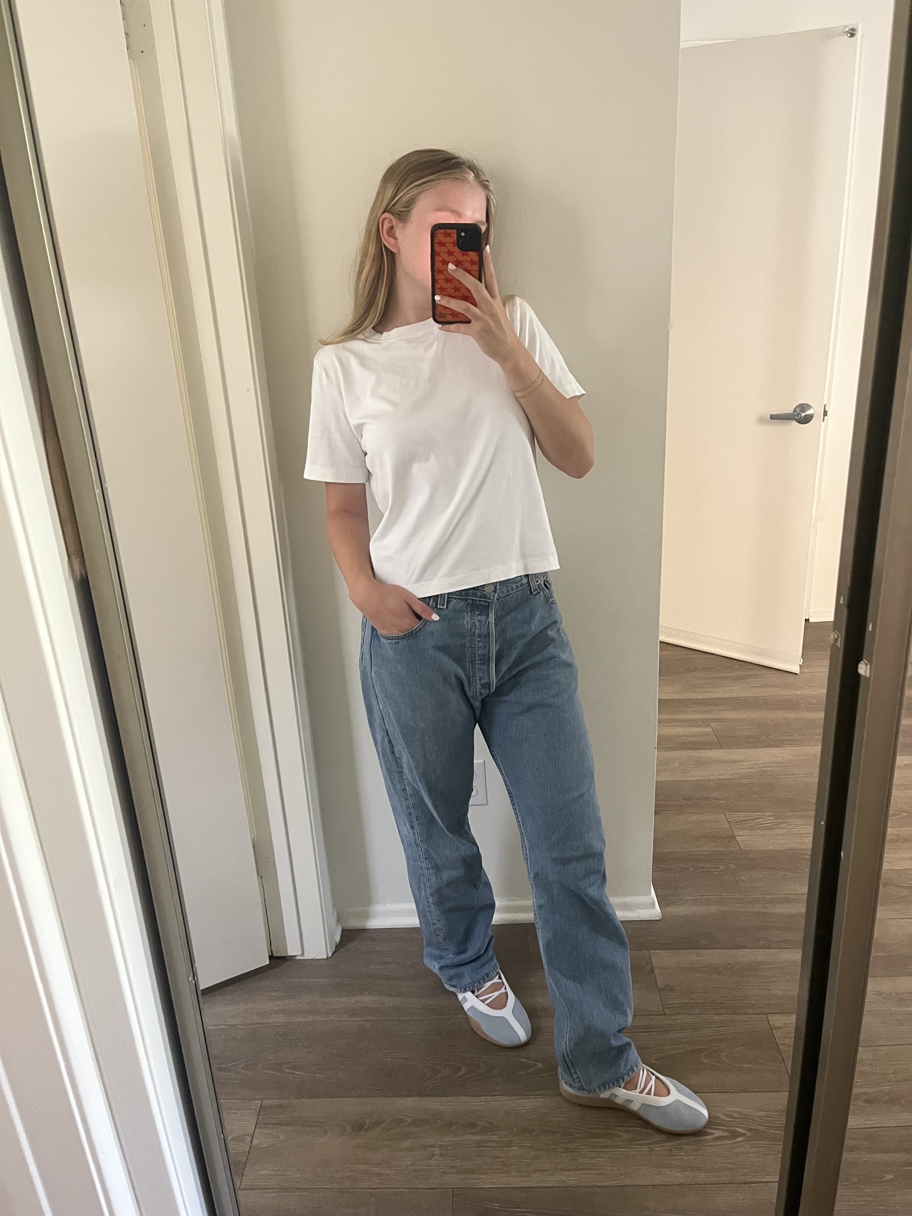 An editor wearing adidas sneakers.