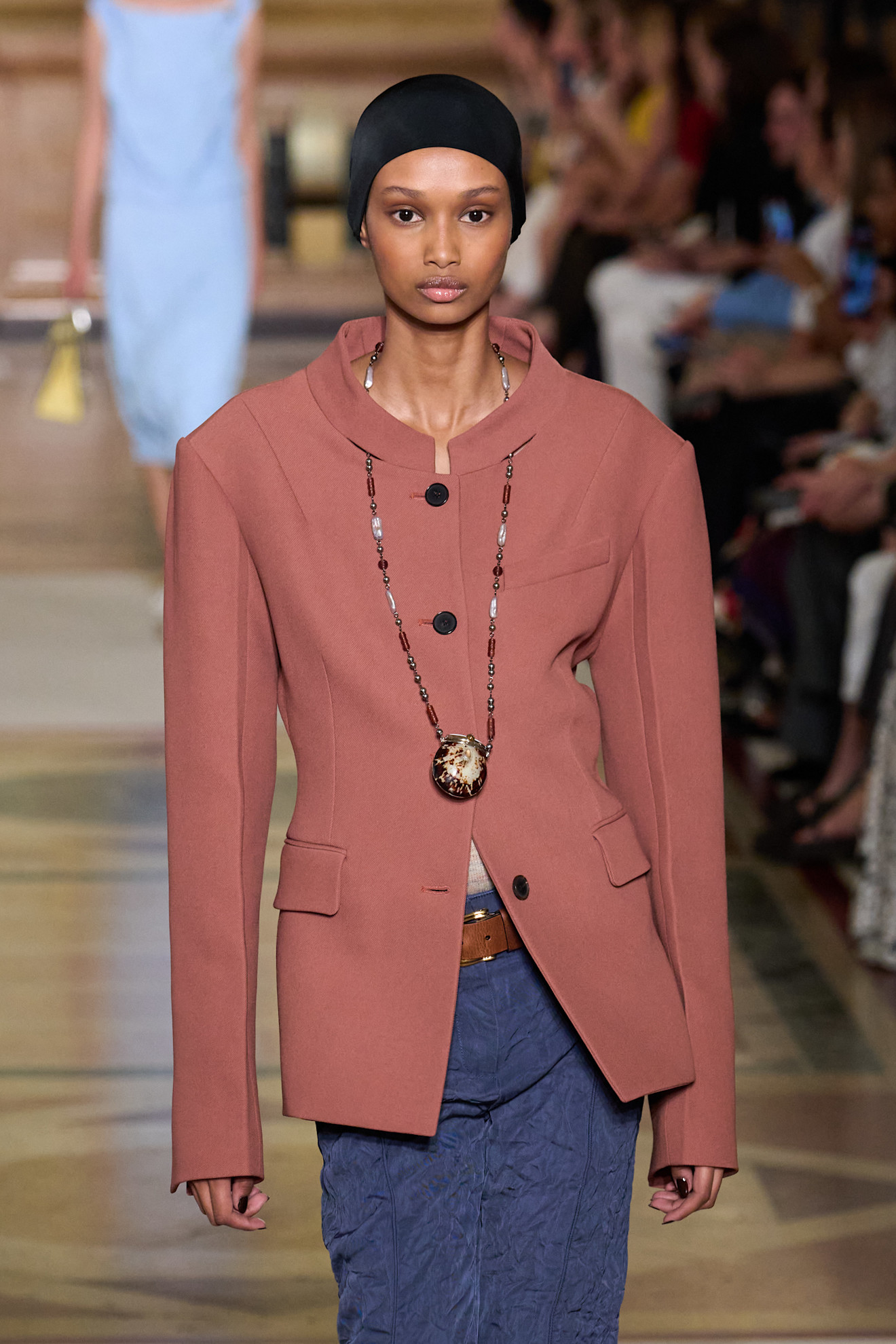 A model wearing a pendant necklace