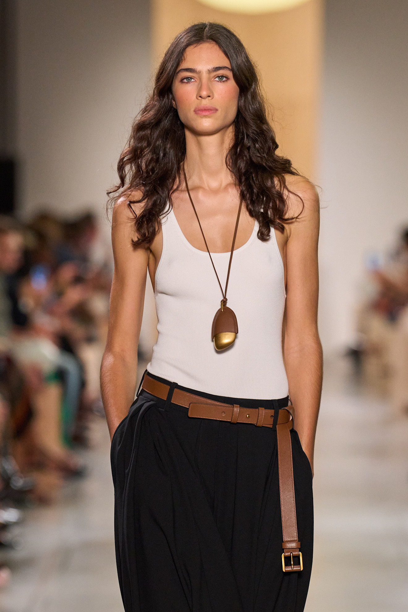 A model wearing a pendant necklace