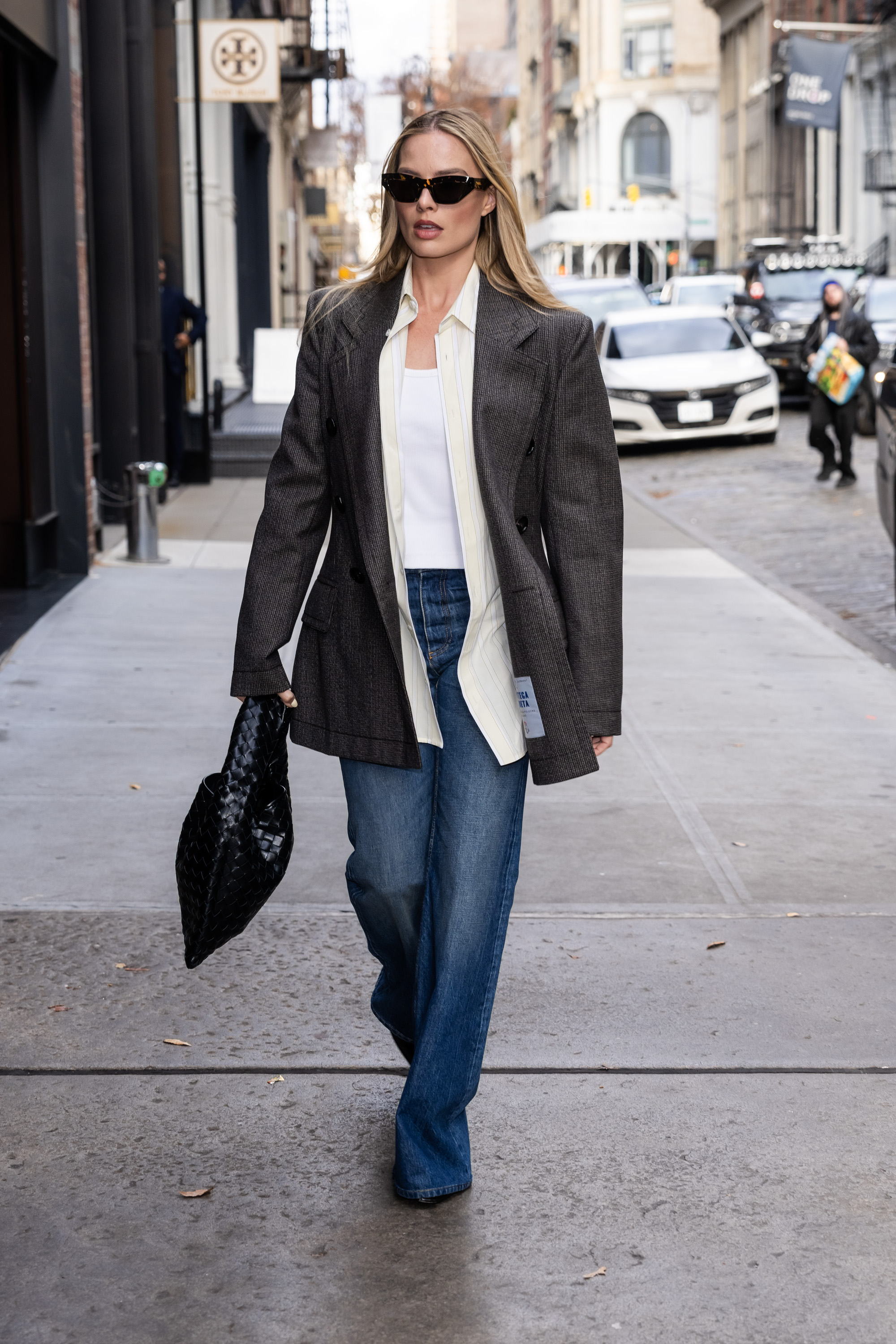 An image of Margot Robbie wearing wide-leg jeans from Bottega Veneta while out in New York in 2023.