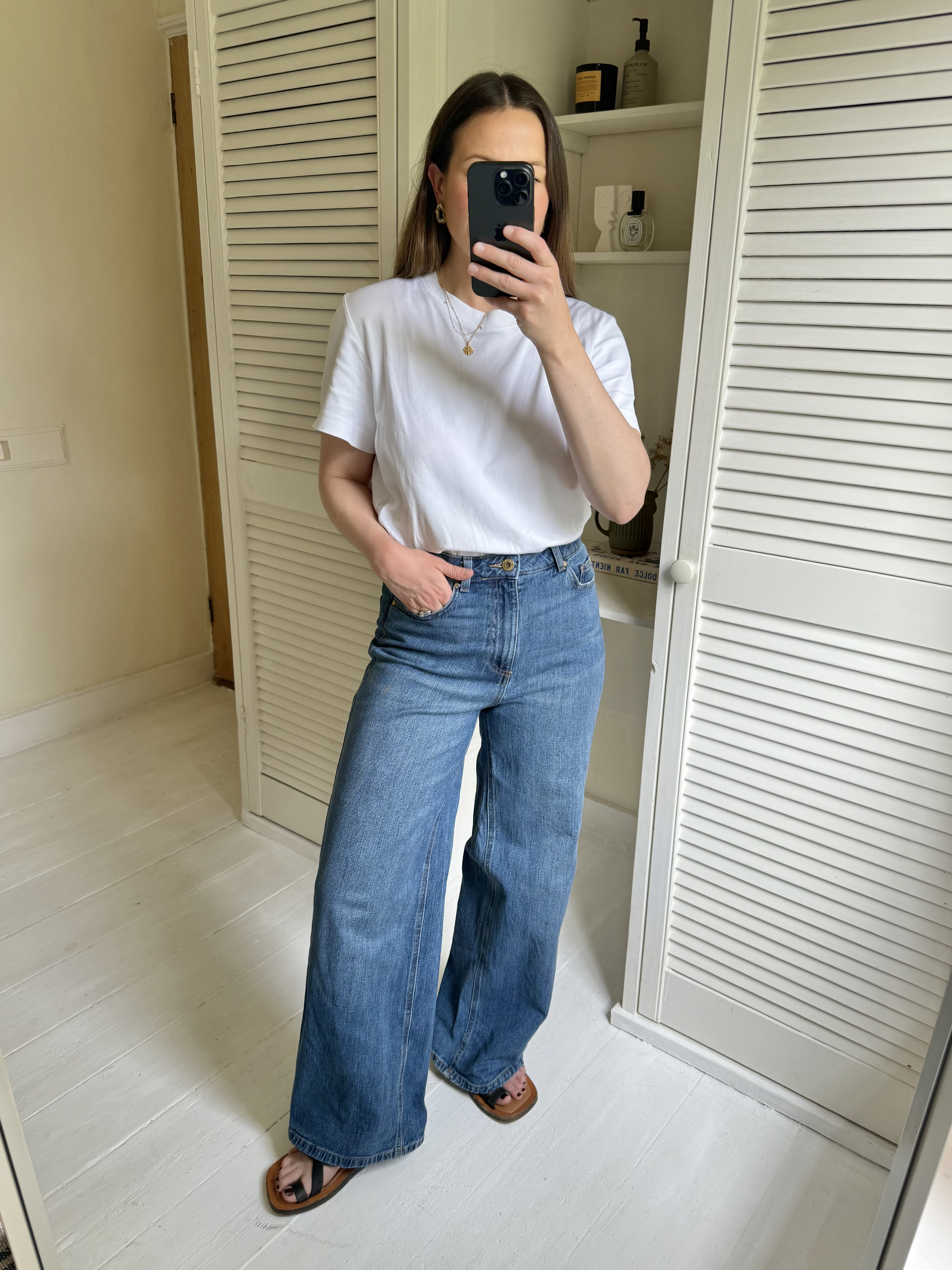 Woman tries on M&amp;amp;S Wide Leg Jeans
