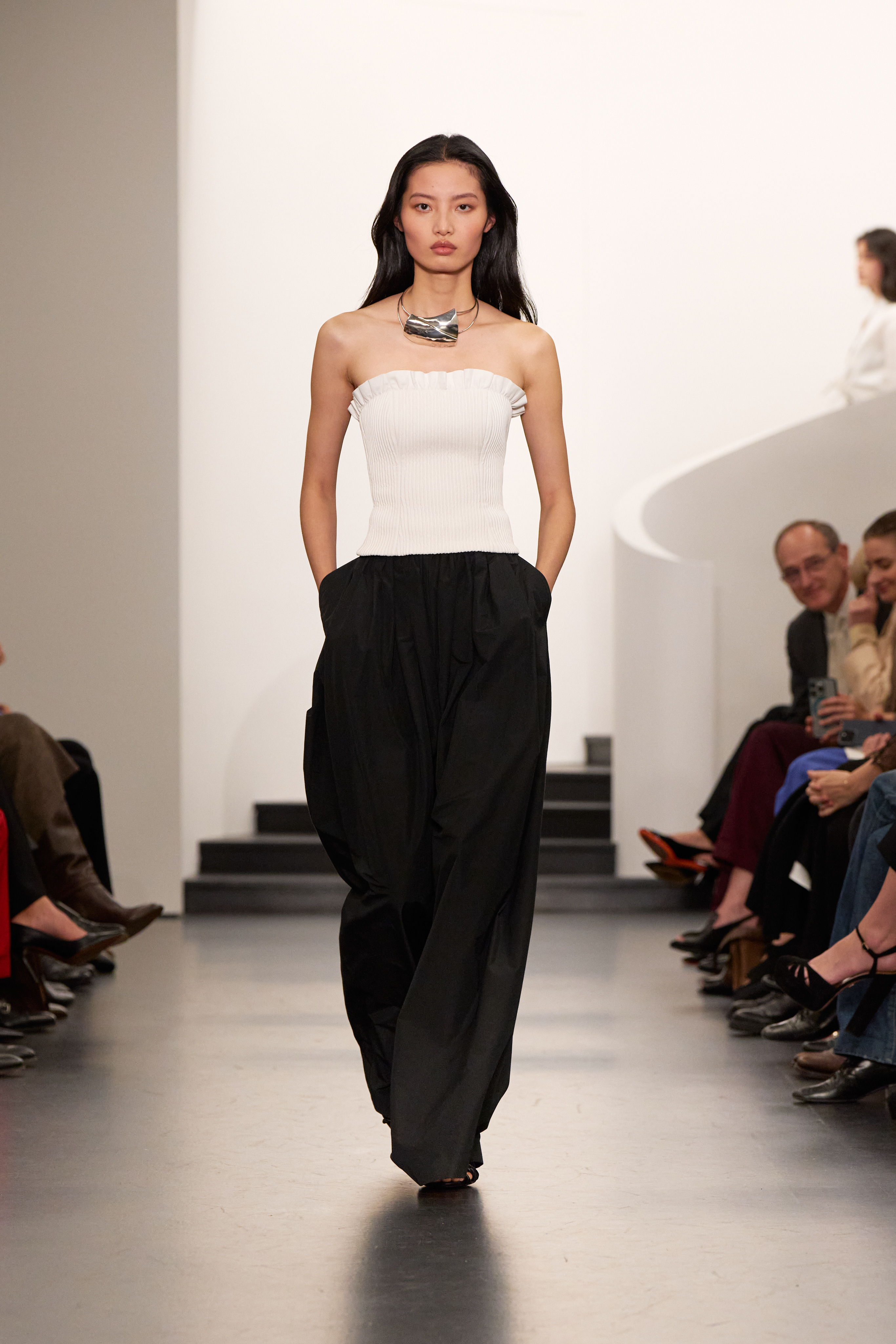 Ralph Lauren Spring/Summer 26 runway model wears black trousers white strapless top