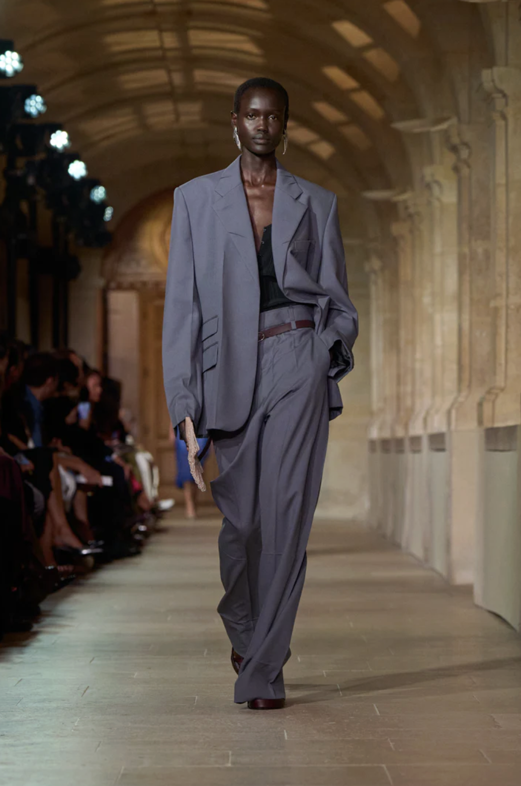 Victoria Beckham Spring/Summer 26 runway model wears navy suit with black lace top