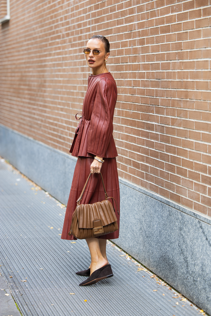 Woman wearing wedge shoes during spring/summer 2026 fashion week.