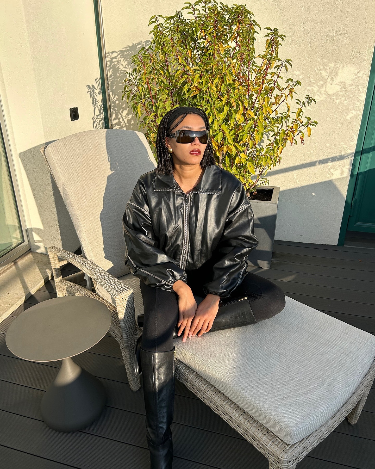 Influencer @lenafarl wears leggings with knee-high boots.