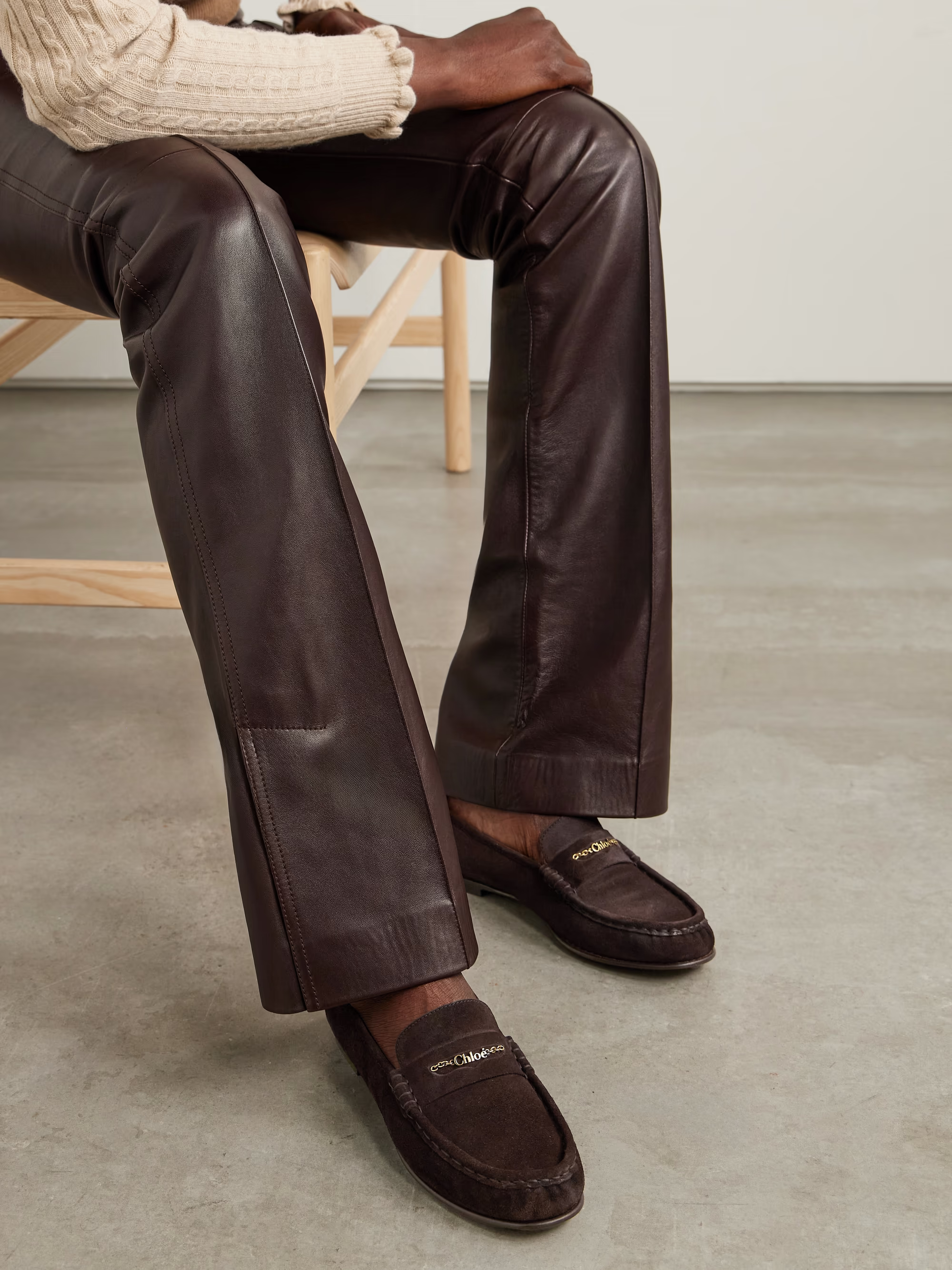 A model wears a pair of Chlo&amp;eacute; suede loafers 