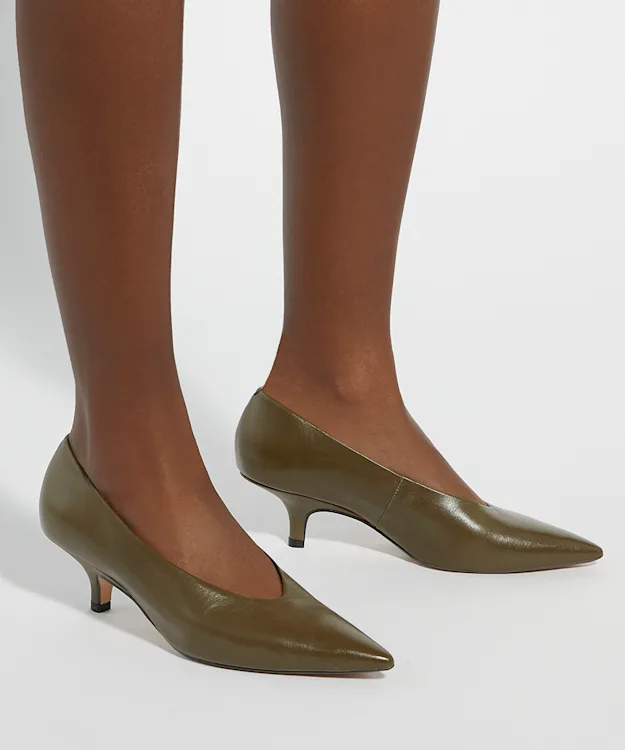 A pair of olive green kitten heel pumps