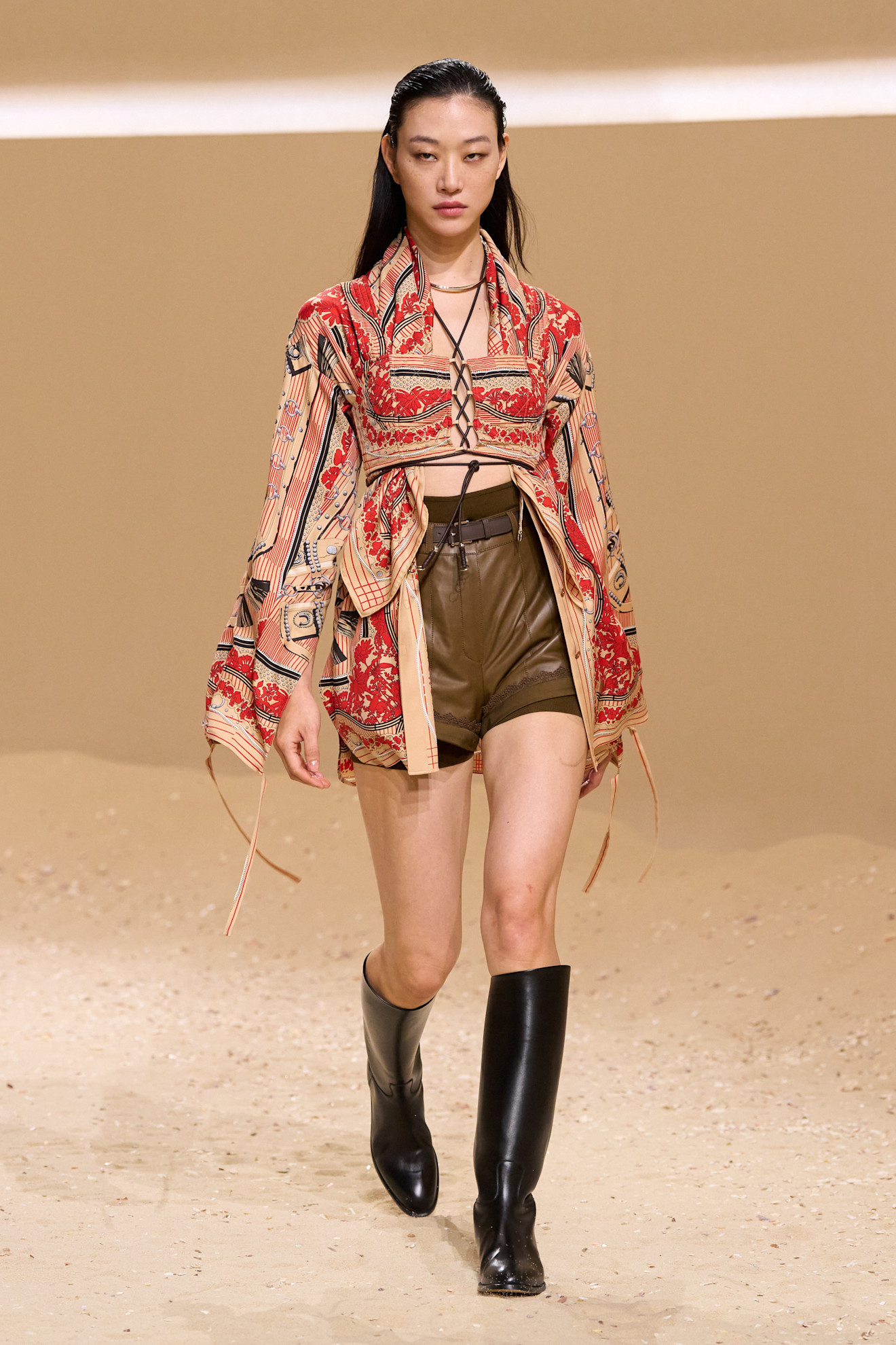 A model walks the hermes spring 2026 runway show in paris.