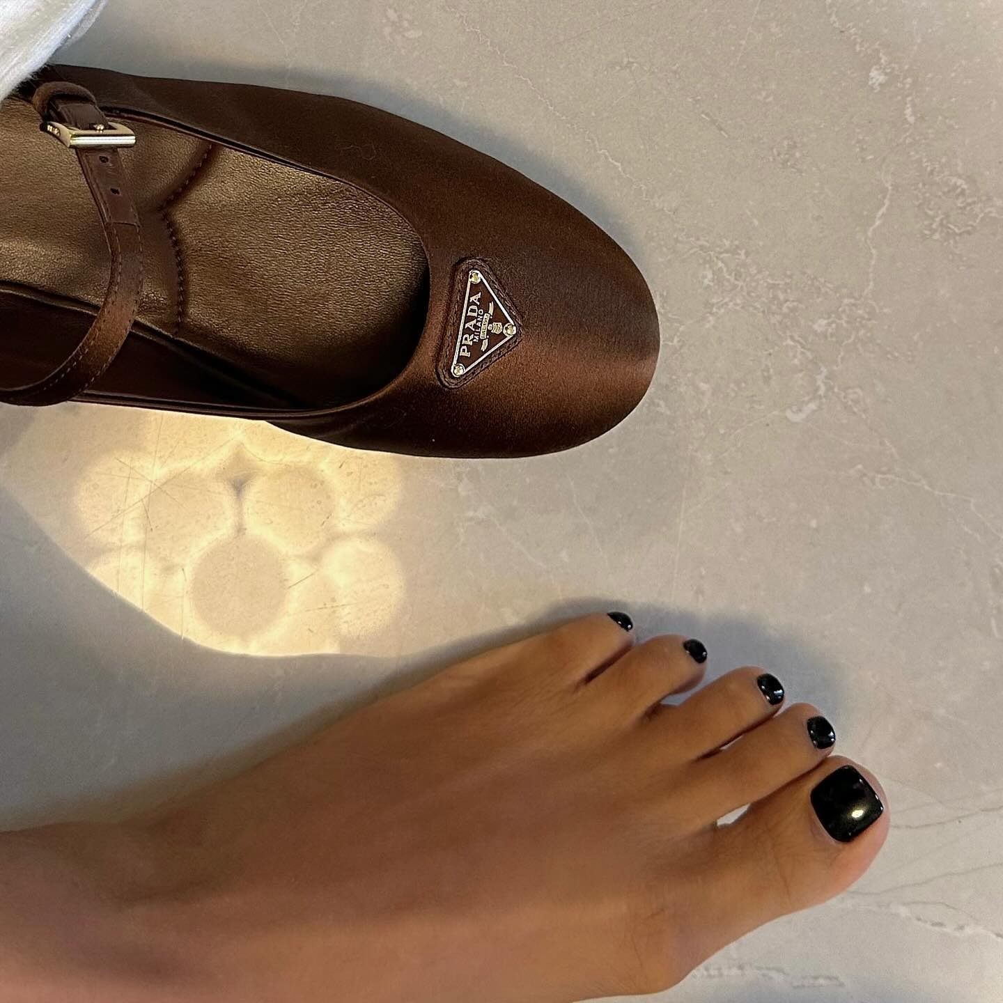 Glossy black pedicure