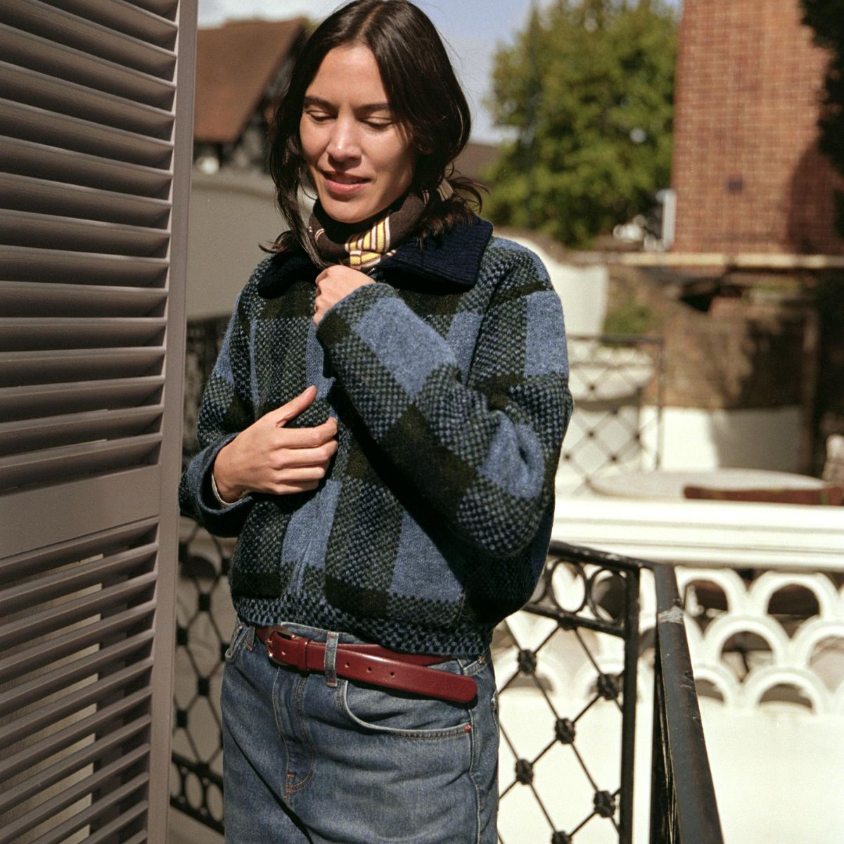 Alexa Chung wearing Zara&#039;s new collection. She&#039;s wearing a checked jacket and blue jeans.