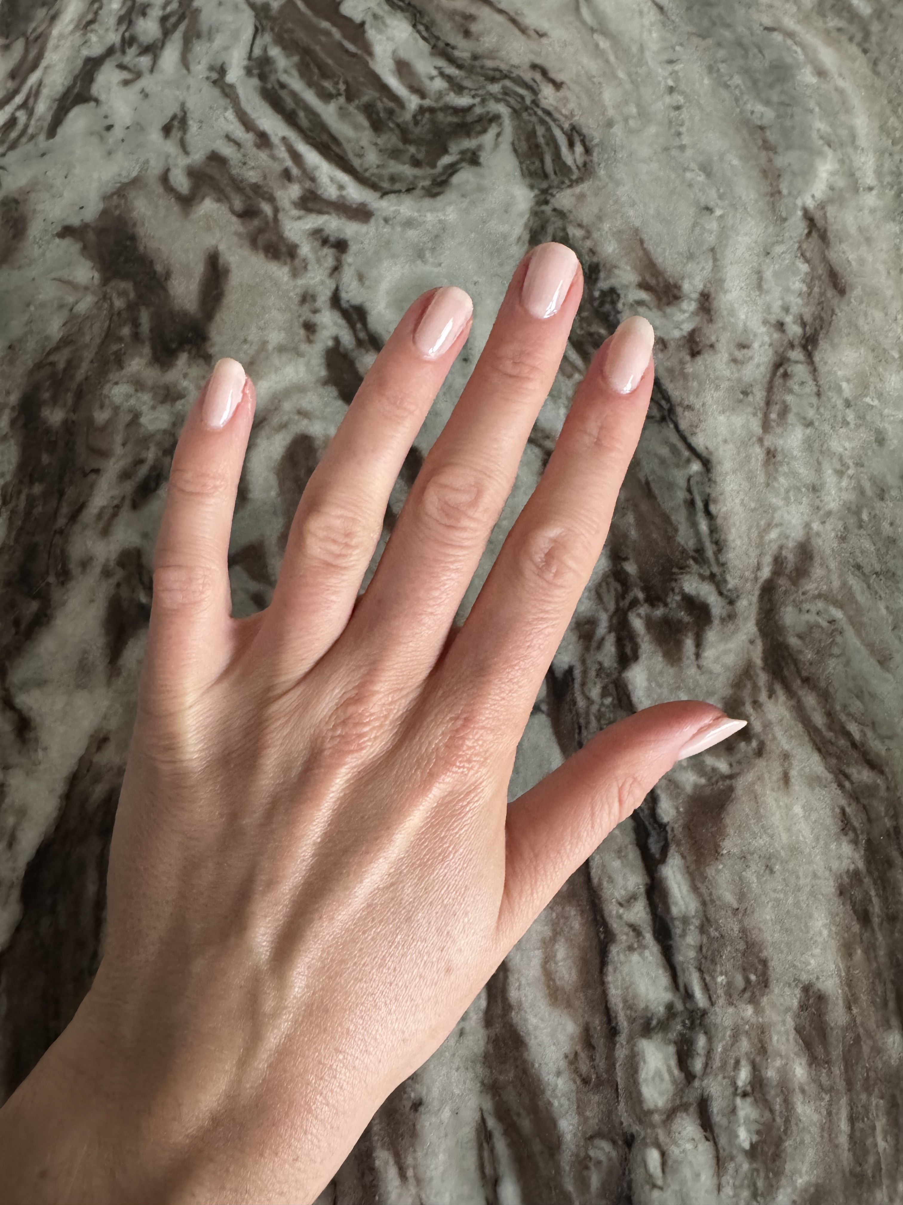 Eleanor wearing two coats of Essie Gel Couture in Fairy Tailor, a sheer light pink nail shade