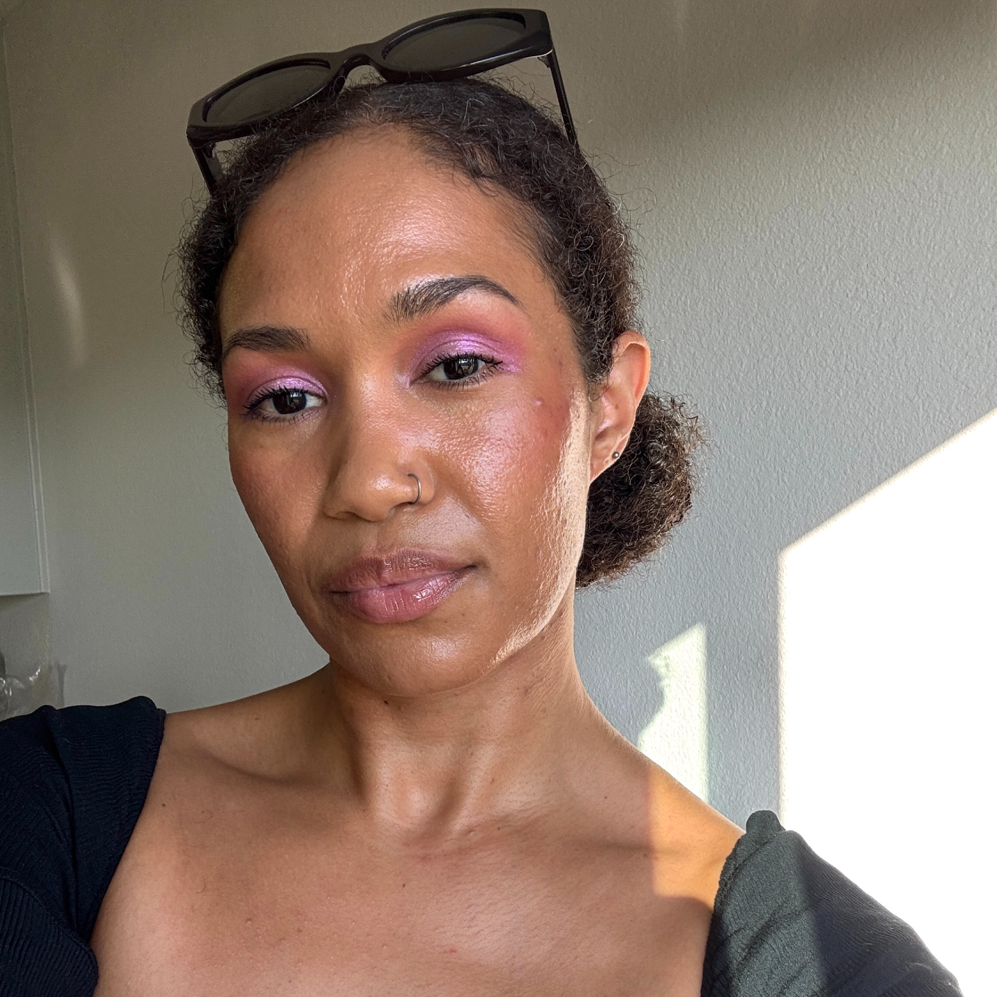 A beauty editor wearing Hung Vanngo&#039;s Color Story Eyeshadow Palette in Rebellious Red &amp;amp; Pink