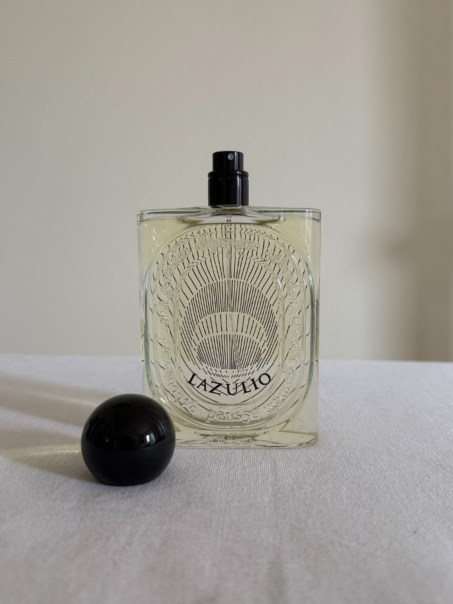 Diptyque&#039;s Lazulio Eau de Parfum with its cap removed