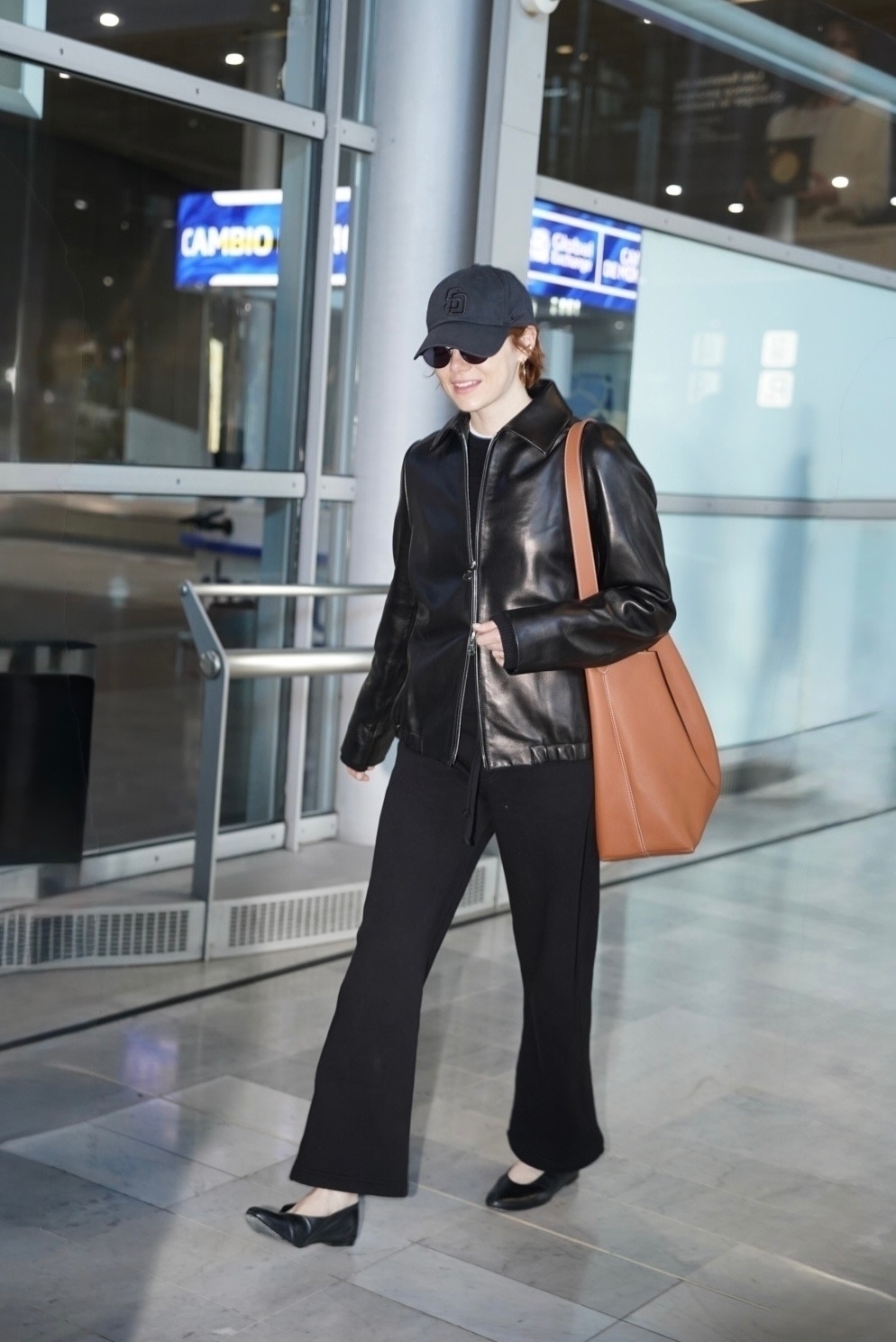 Oscar-winning actress Emma Stone was spotted at the Paris airport, touching down ahead of fashion week events.