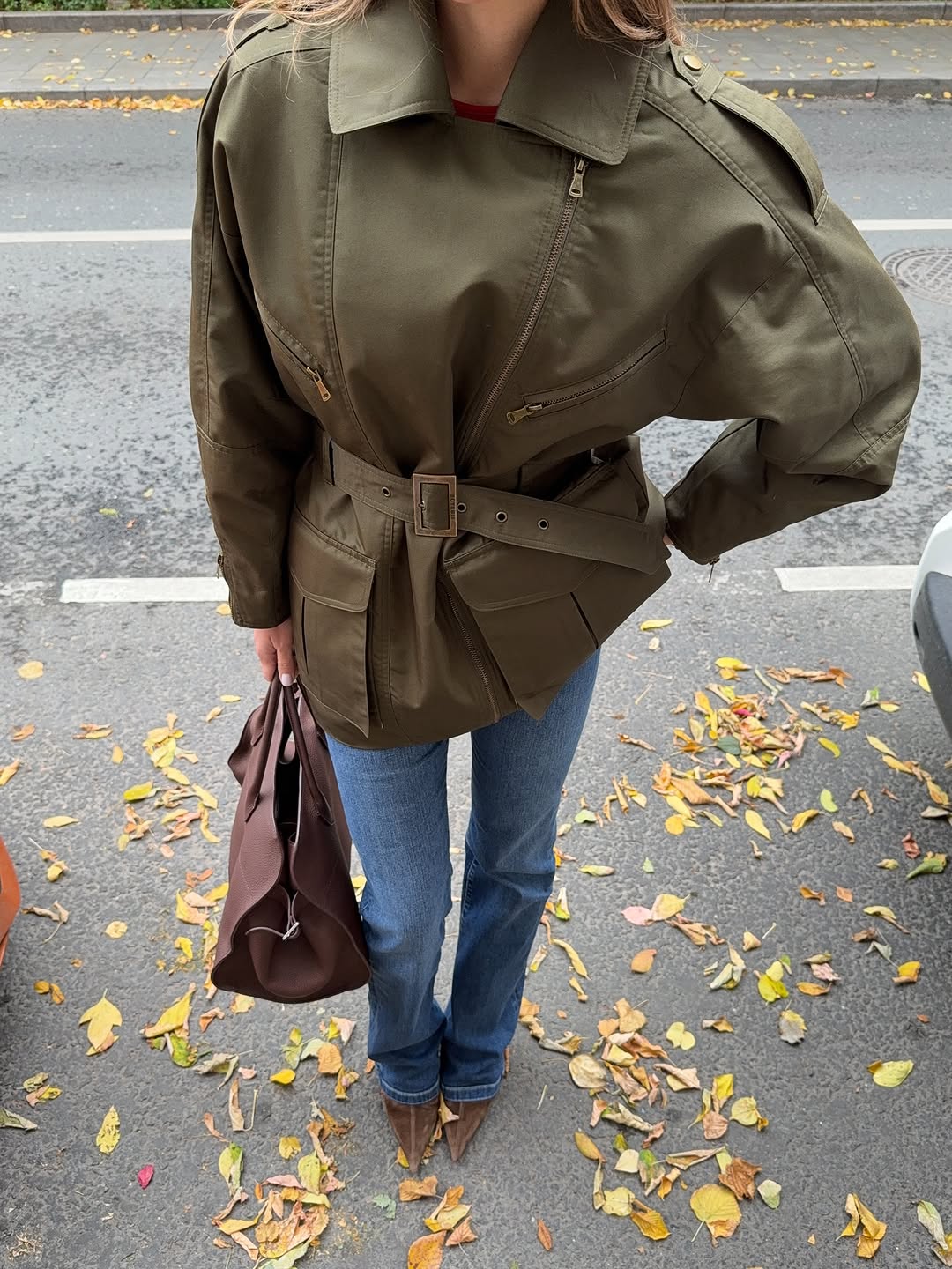 woman wearing suede pointed toe ankle boots trend 2025