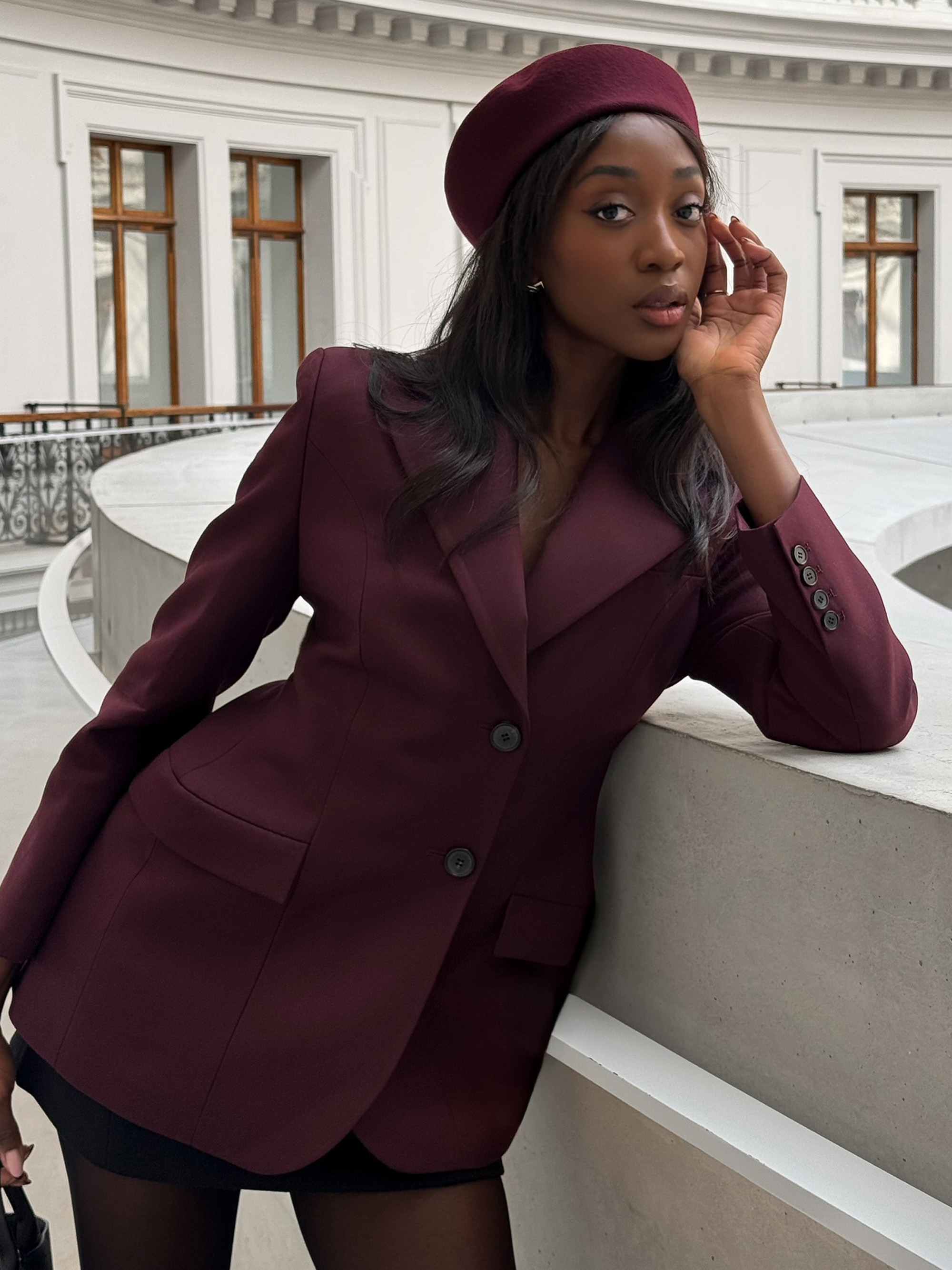 Emmanuelle Koffi with glowy skin and mauve lips.