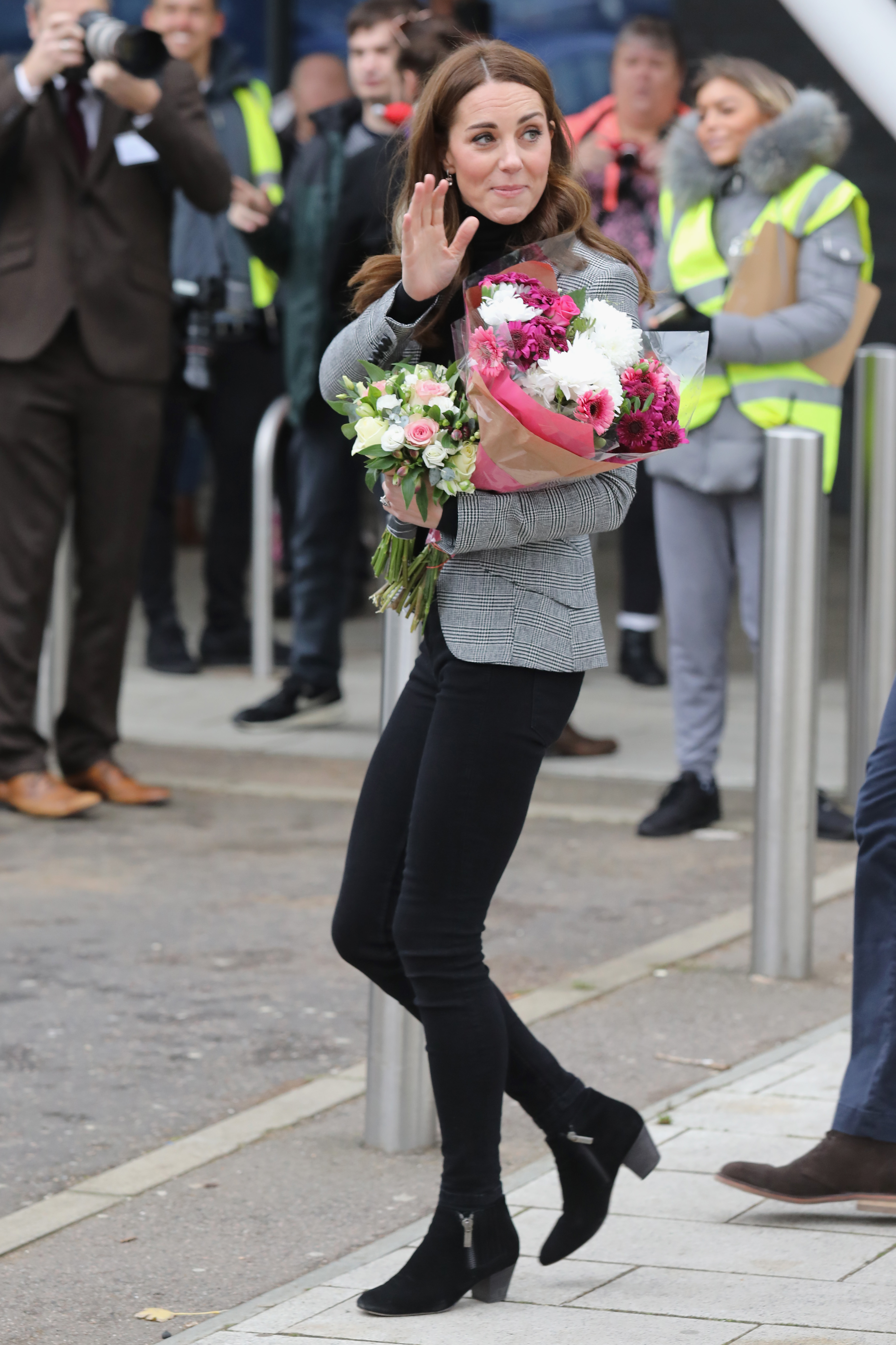 Kate Middleton wears skinny jeans and boots with a jacket
