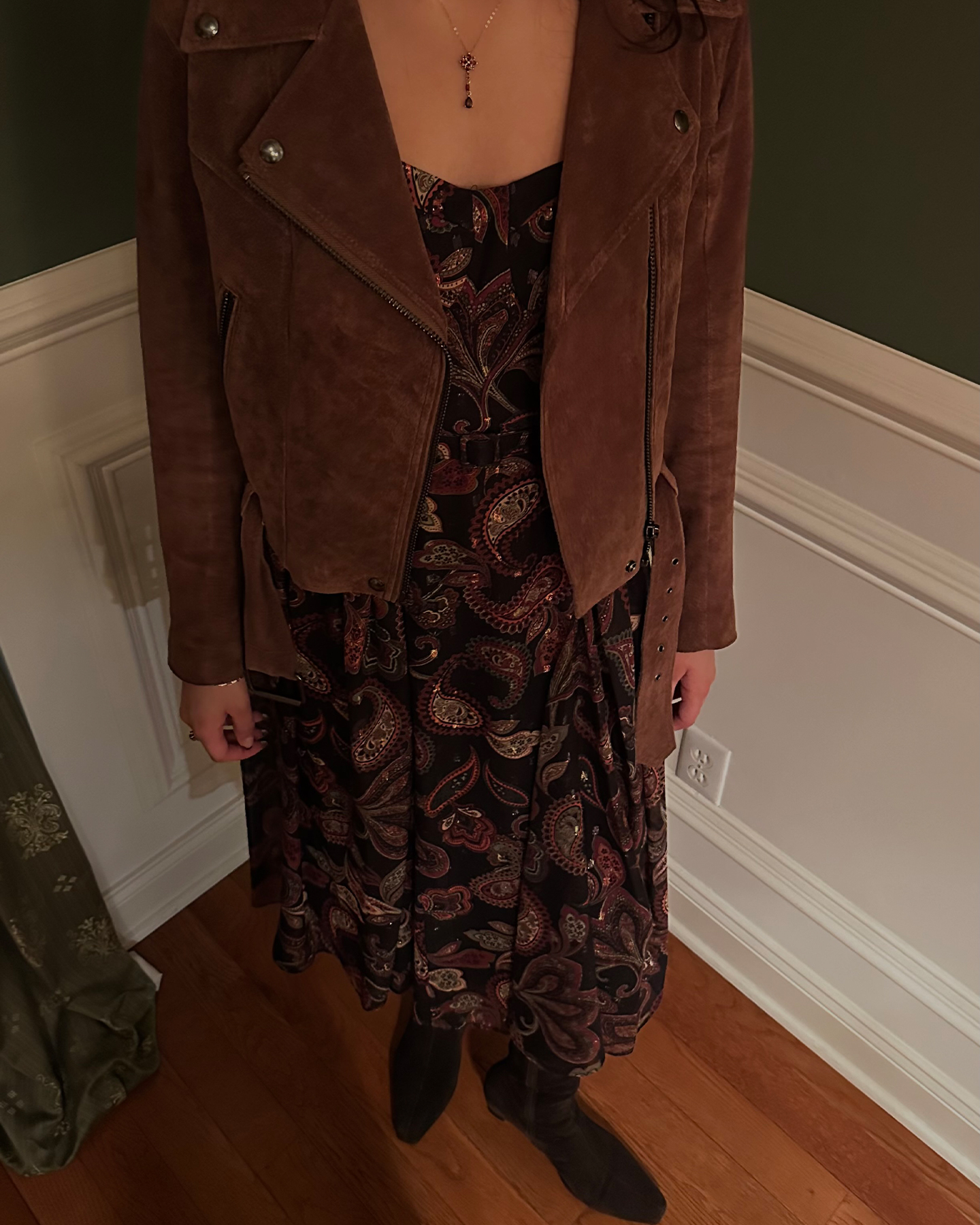 Editor Josephine Hadjiloucas wears a paisley BCBG basque waist dress with brown boots.