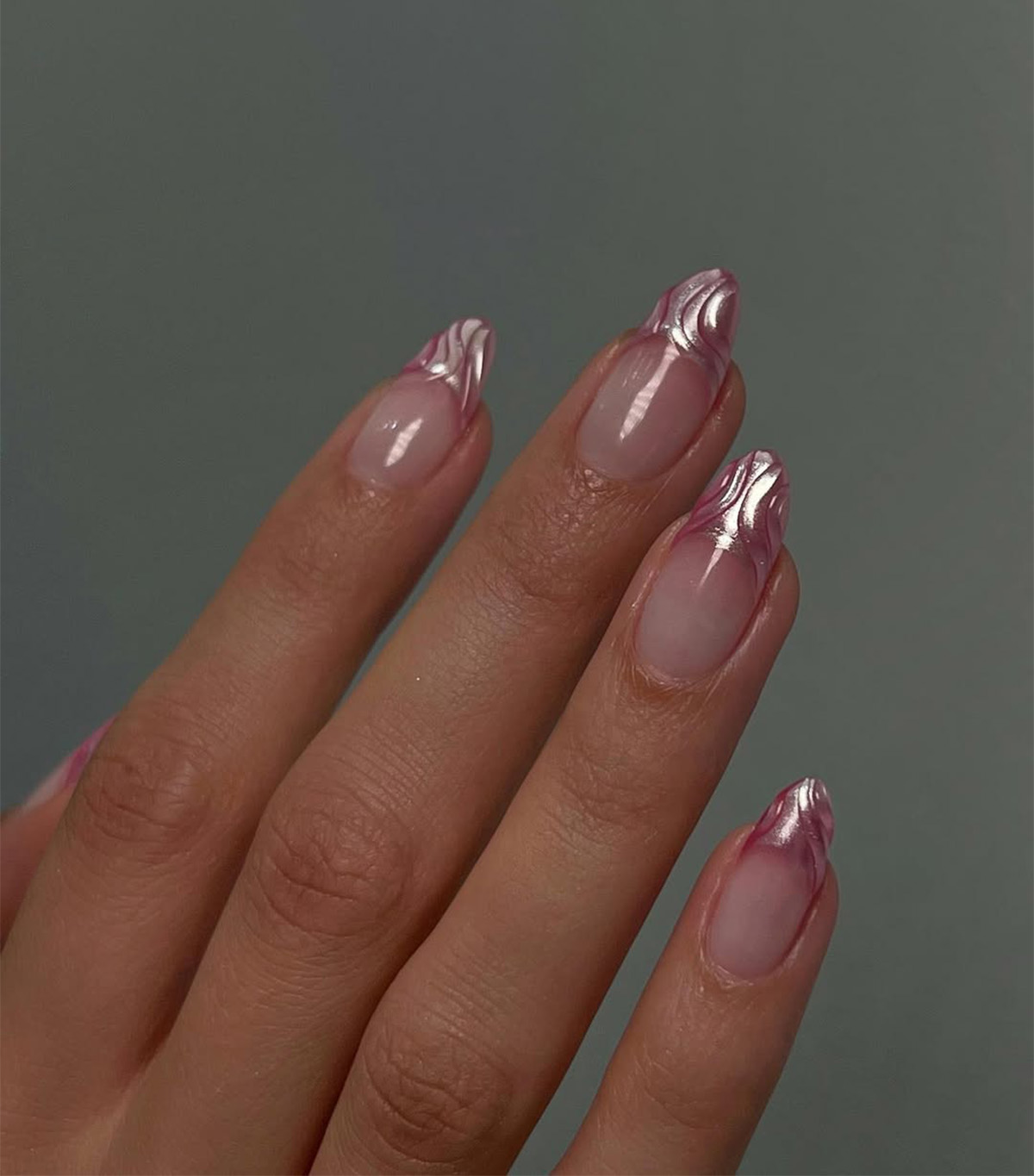 A textured pink chrome French manicure by Queenie Nguyen.