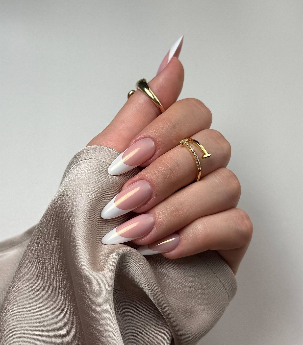 A classic chrome French manicure by Sofiia Mazur.