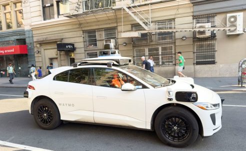 Driverless Waymo Vehicle Cruises Through Tense Police Situation In L.A. With Passenger Inside