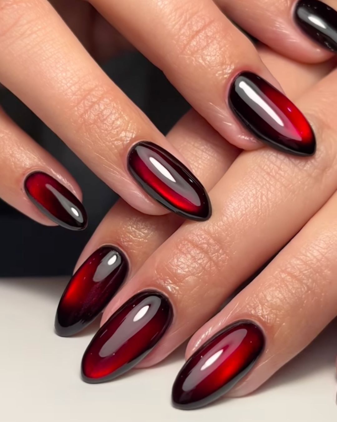 Velvet glass red and black nails.