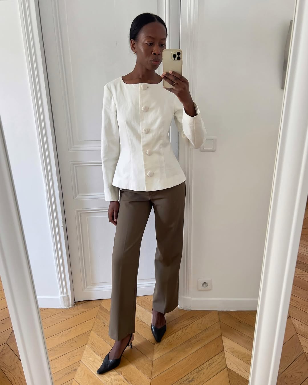 @sylviemus_ wears a peplum top