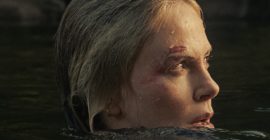 It’s Predator vs. Prey When Taron Egerton Hunts Charlize Theron in the Brutal First Trailer for Netflix’s ‘Apex’