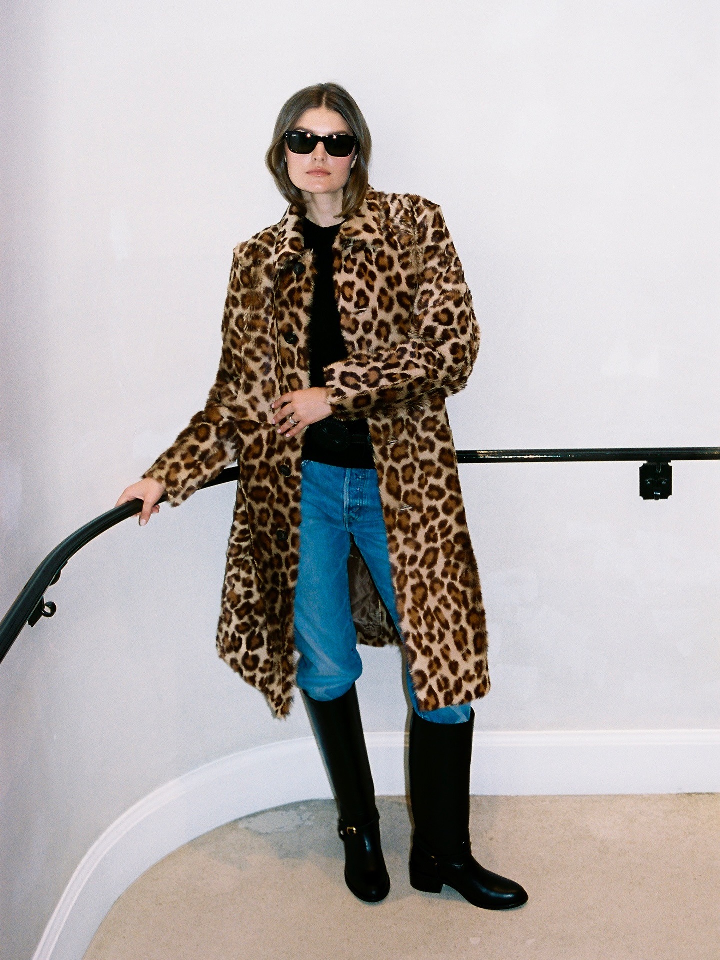 @styledsara wearing riding boots.