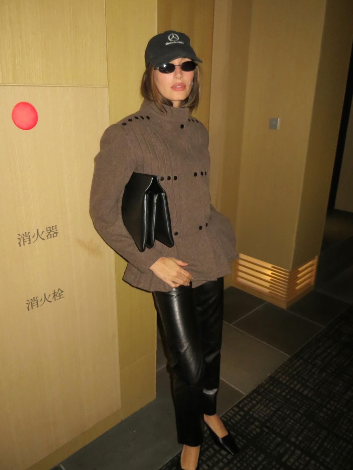 Hailey Bieber wearing leather pants in 2025.