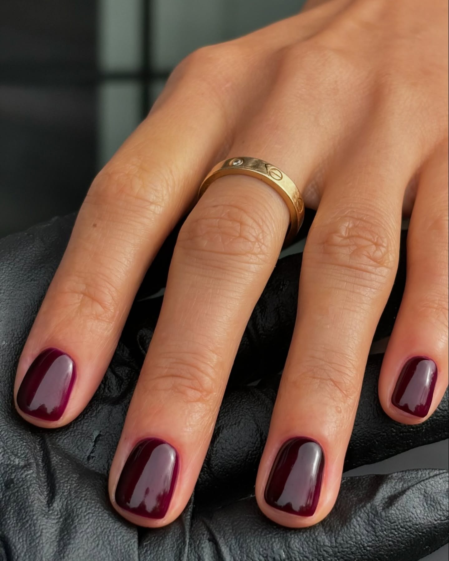 A glossy burgundy manicure