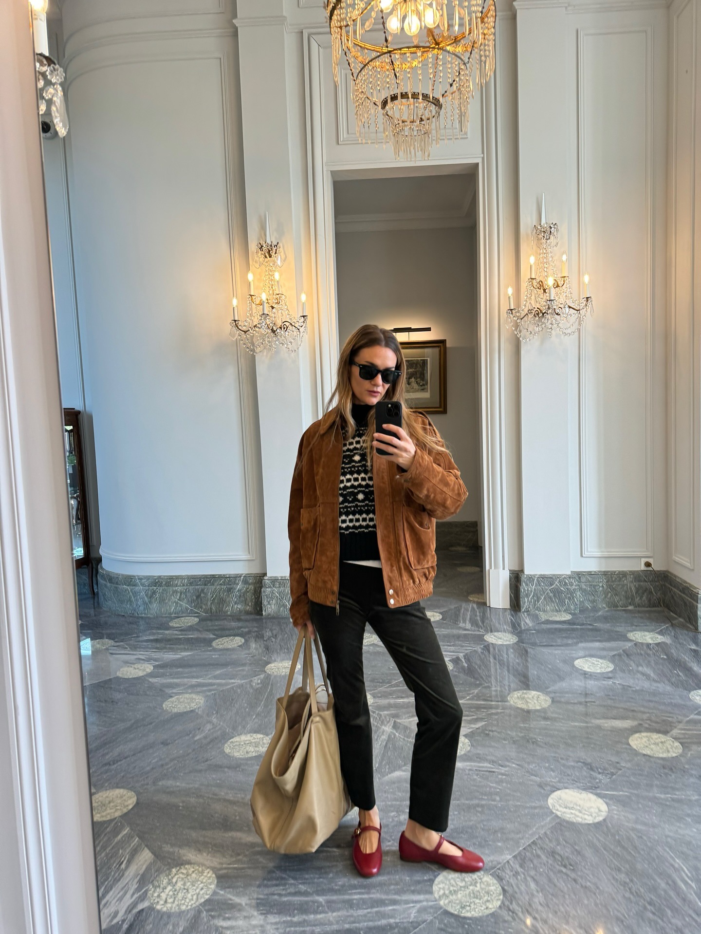 Influencer wearing black pants with red Mary Janes