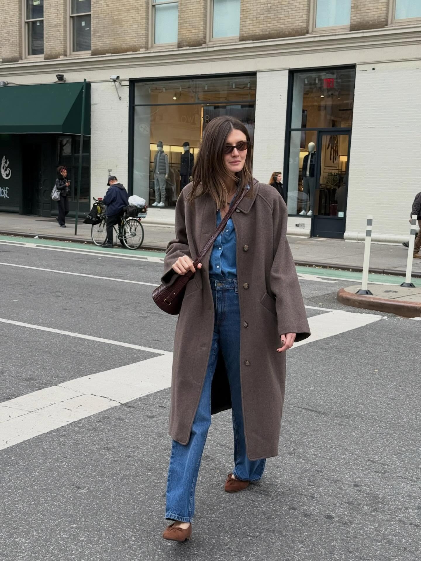 Influencer wearing a denim shirt with jeans and brown suede ballet flats