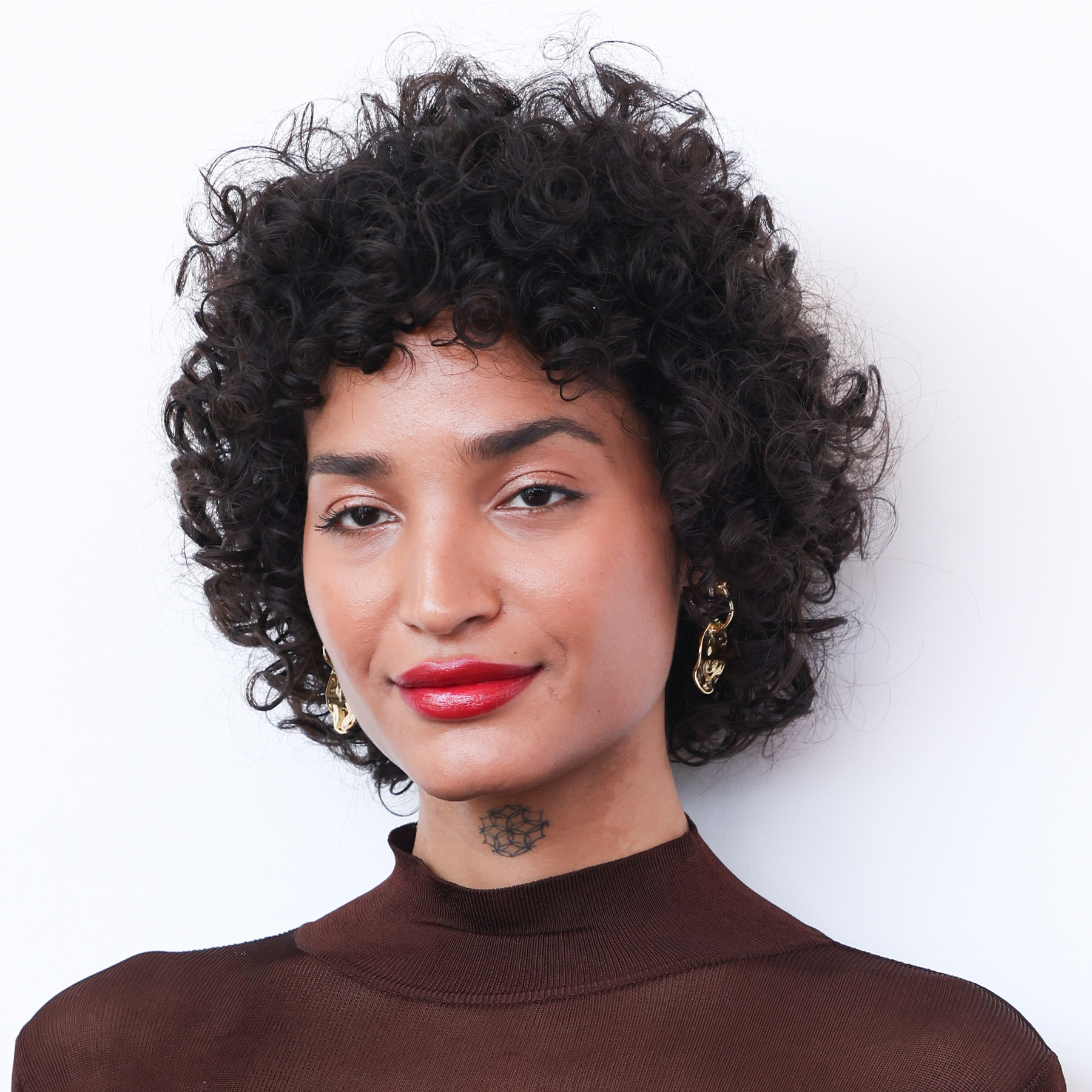 Indya Moore attends the &quot;Father Mother Sister Brother&quot; photocall during the 82nd Venice International Film Festival with a wolf cut