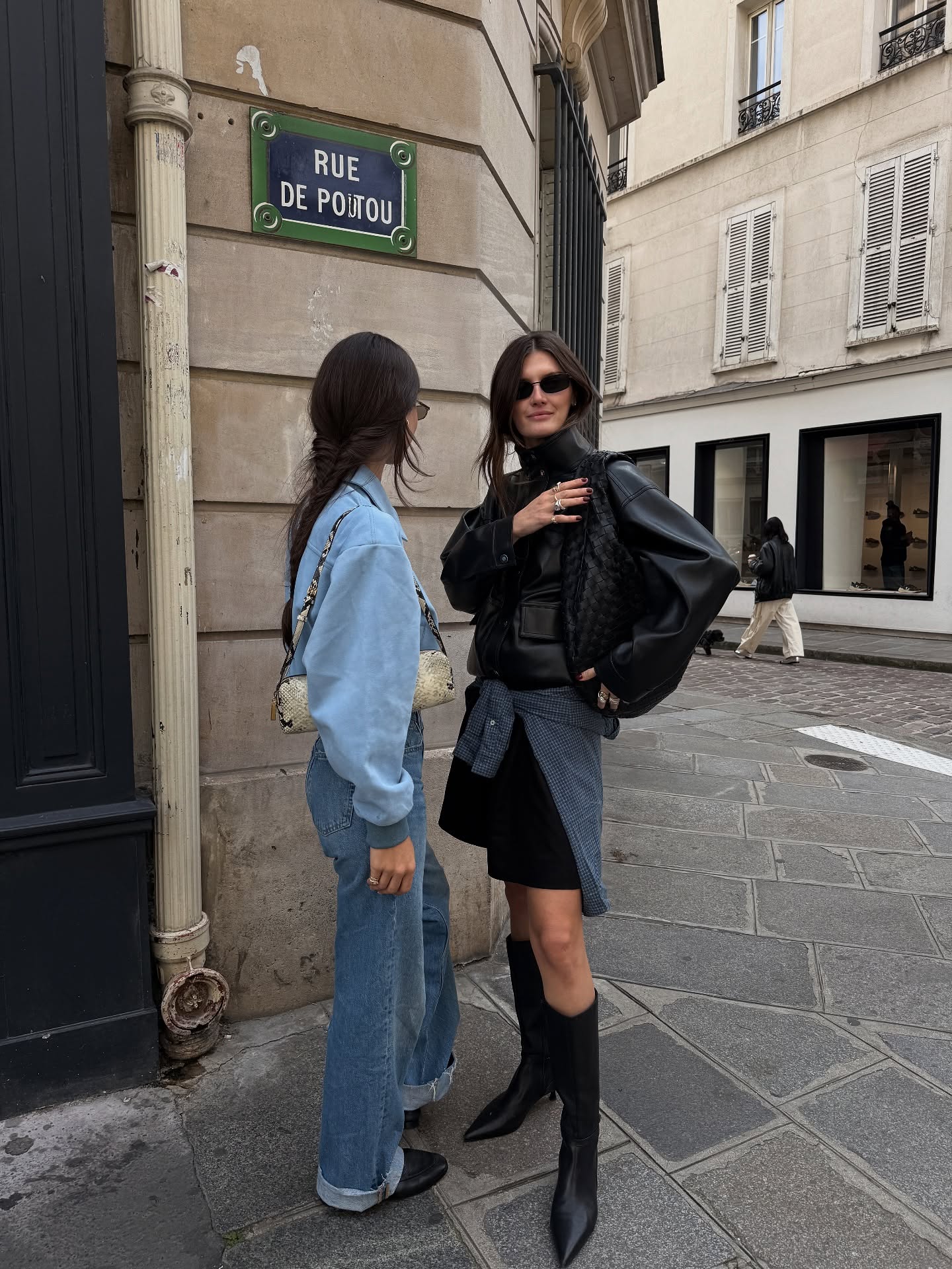 An image of Coco Schiffer with a friend wearing one of the biggest 2026 jean trends, whilst in Paris.